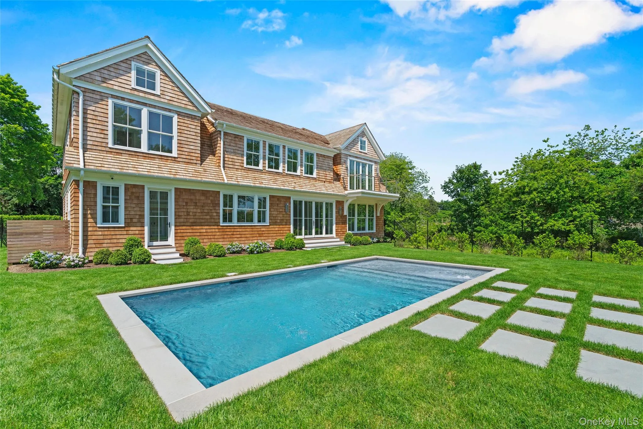Sun soaked Heated saltwater Gunite pool with stadium steps takes center stage all summer long. Sun soaked Heated saltwater Gunite pool with stadium steps takes center stage all summer long.