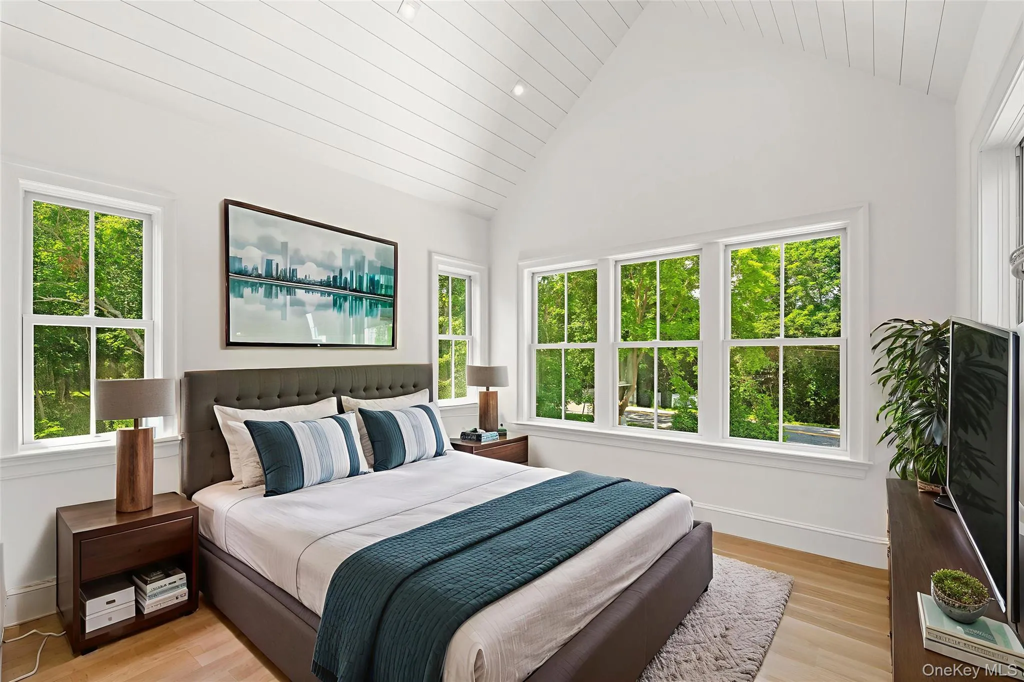 Bedroom featuring vaulted ceiling, wooden ceiling, and light wood-style floors Bedroom featuring vaulted ceiling, wooden ceiling, and light wood-style floors