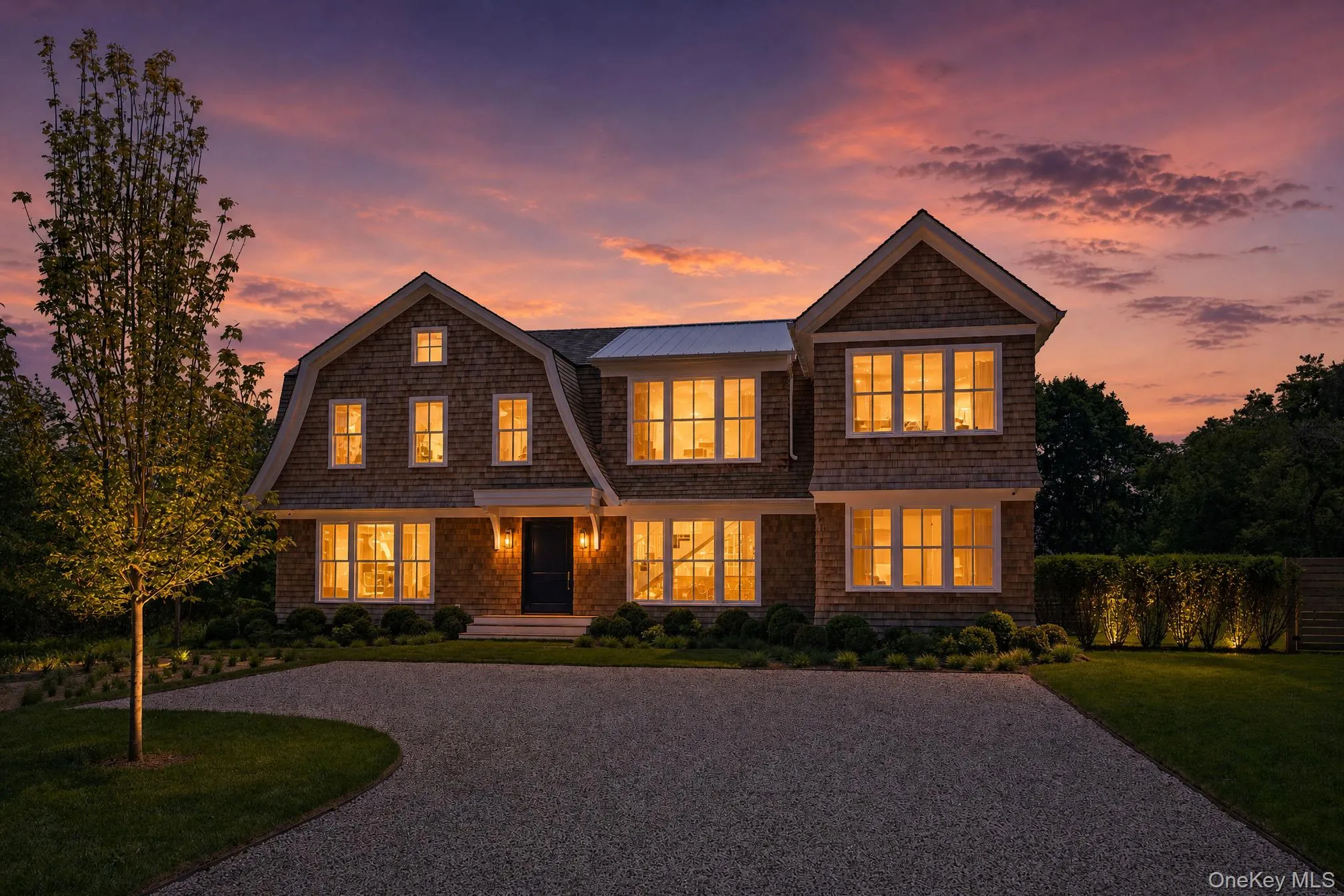 Twilight exterior showcasing this extraordinary new waterfront construction, where elegant design meets serene coastal luxury and breathtaking waterfront surroundings. Twilight exterior showcasing this extraordinary new waterfront construction, where elegant design meets serene coastal luxury and breathtaking waterfront surroundings.