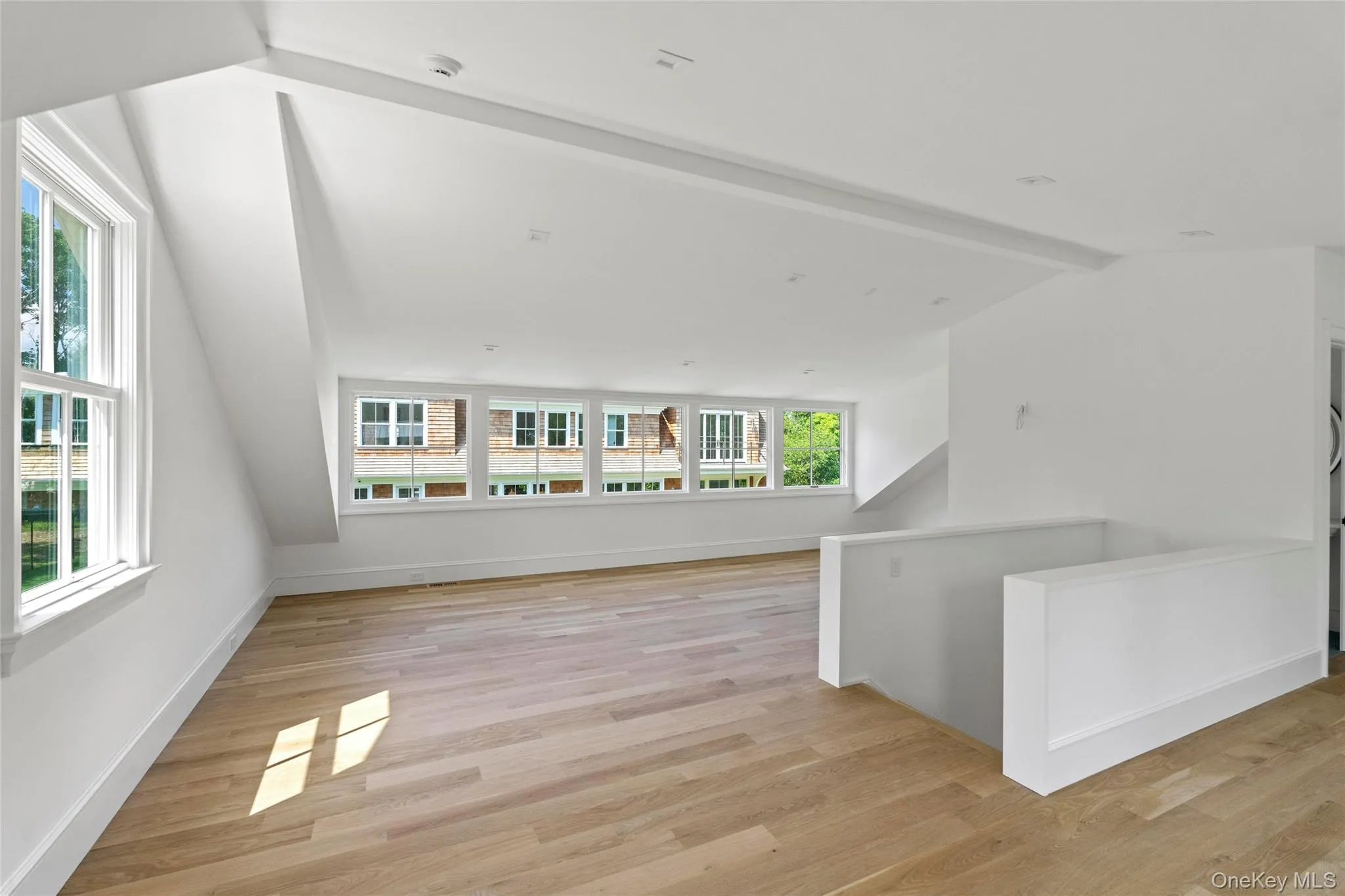 2nd floor Living room / Guest space with Full Bath featuring Oak flooring and Waterviews 2nd floor Living room / Guest space with Full Bath featuring Oak flooring and Waterviews