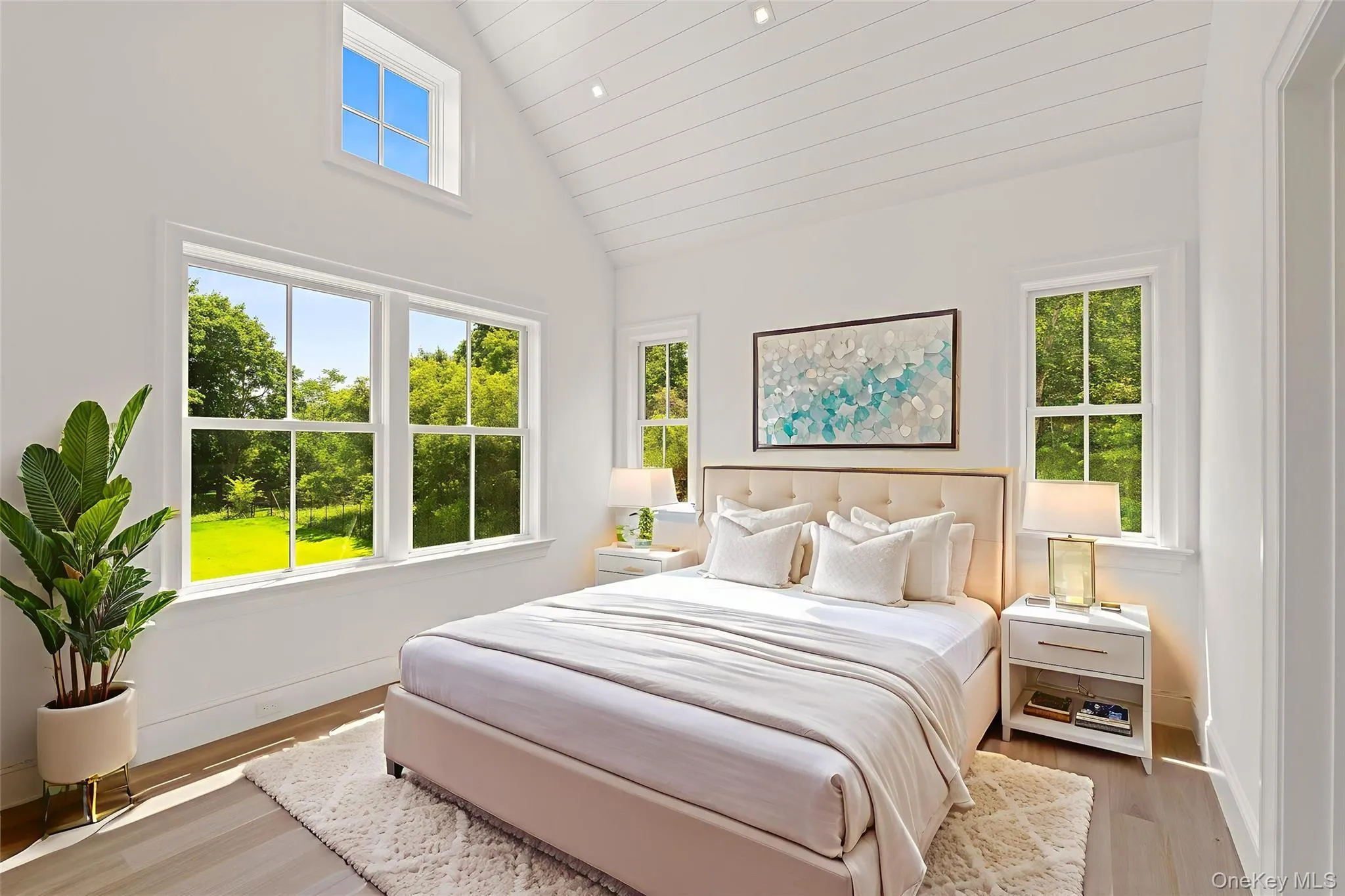 Bedroom with high vaulted ceiling, wood finished floors, wooden ceiling, and recessed lighting Bedroom with high vaulted ceiling, wood finished floors, wooden ceiling, and recessed lighting