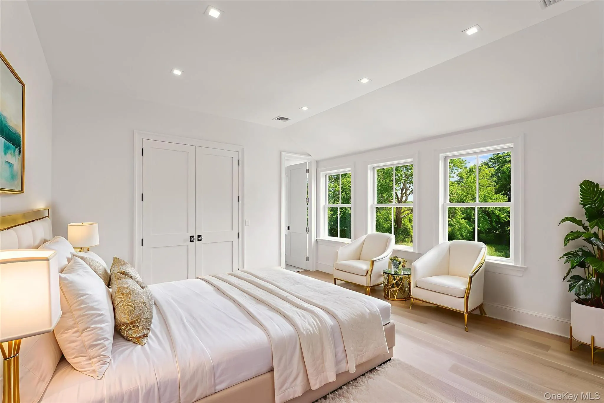 Bedroom featuring vaulted ceiling, light wood-style flooring, recessed lighting, and a closet Bedroom featuring vaulted ceiling, light wood-style flooring, recessed lighting, and a closet