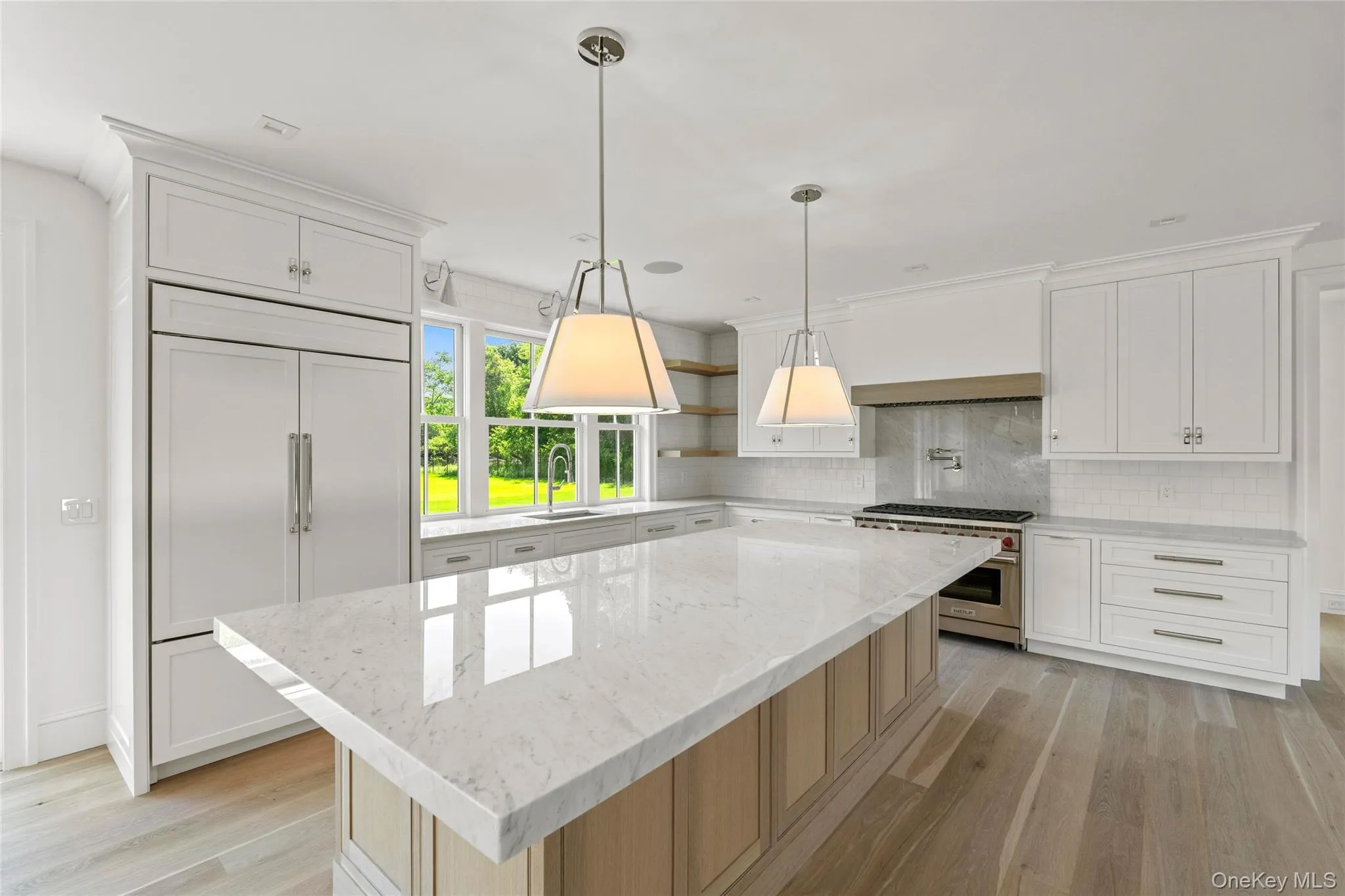 Custom Kitchen with Carrera Marble high end appliances, light wood-style floors, backsplash, a kitchen island, and white oak cabinetry- 10ft island- All Custom Chefs Kitchen Custom Kitchen with Carrera Marble high end appliances, light wood-style floors, backsplash, a kitchen island, and white oak cabinetry- 10ft island- All Custom Chefs Kitchen