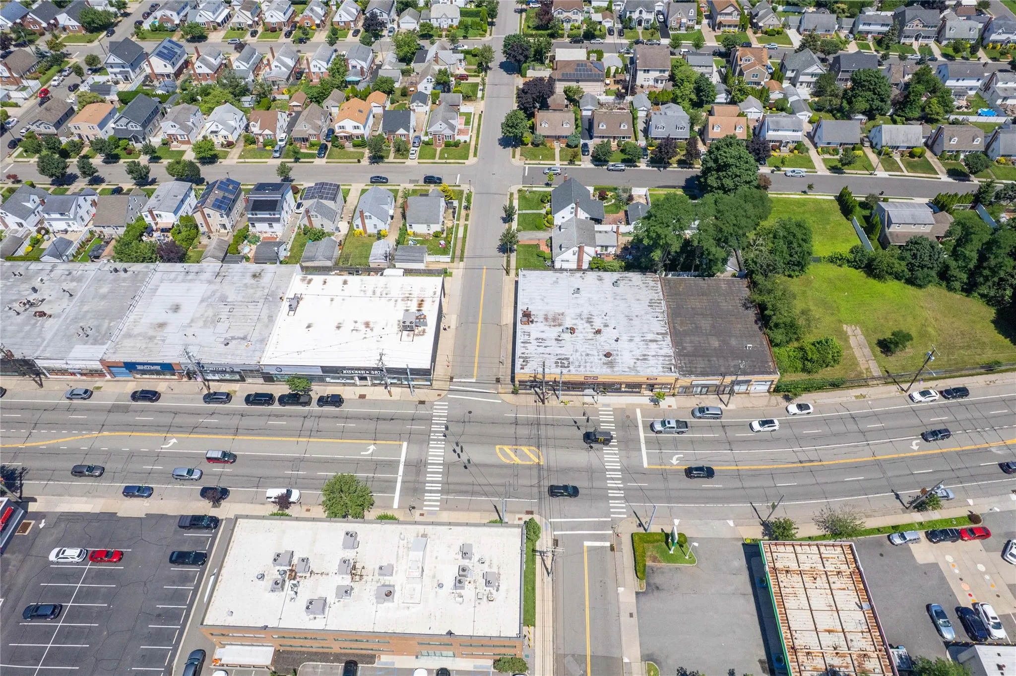 Aerial view of property and surrounding area featuring nearby suburban area Aerial view of property and surrounding area featuring nearby suburban area