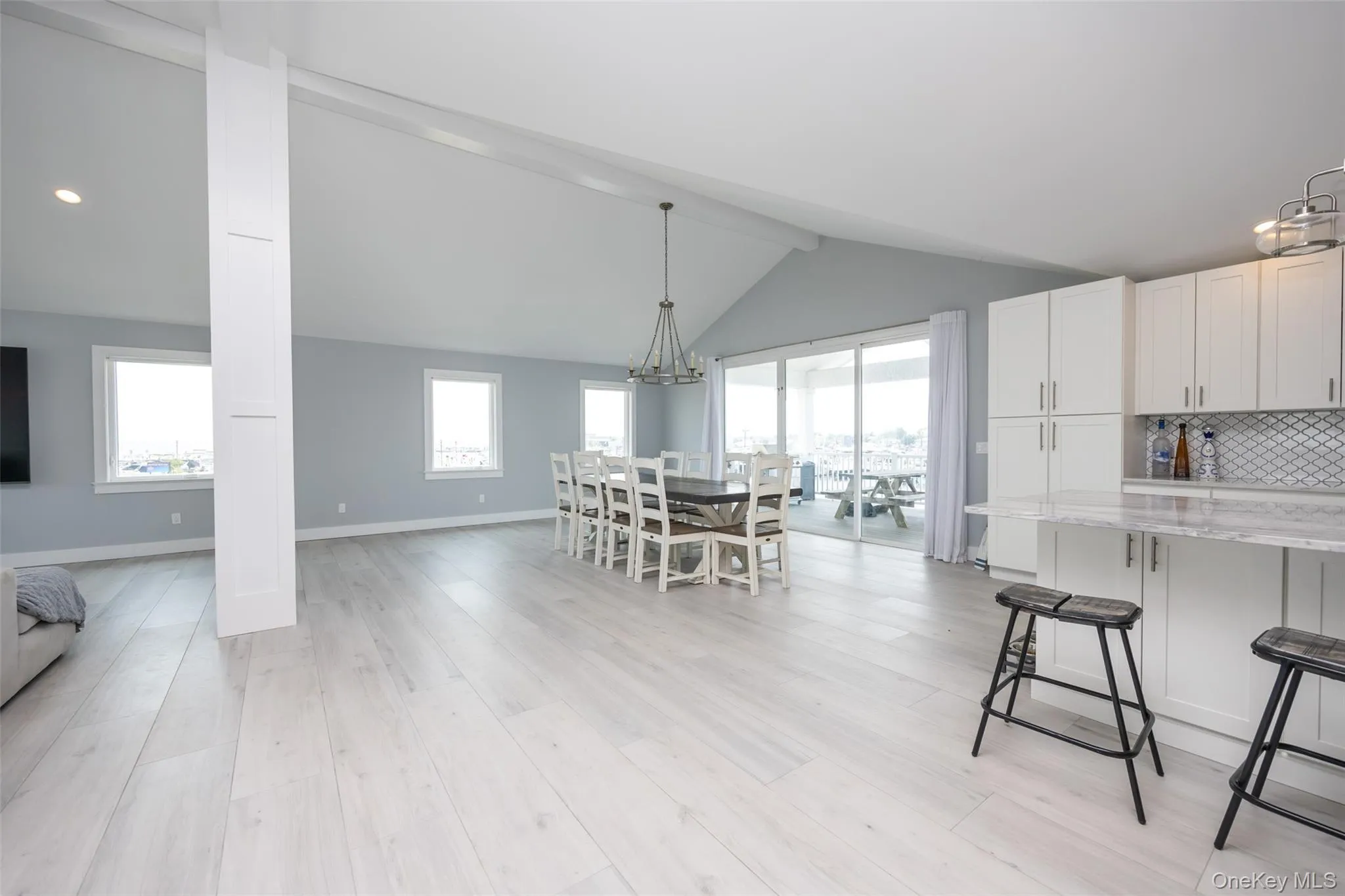 Dining space featuring light wood-style floors, a chandelier, and recessed lighting Dining space featuring light wood-style floors, a chandelier, and recessed lighting