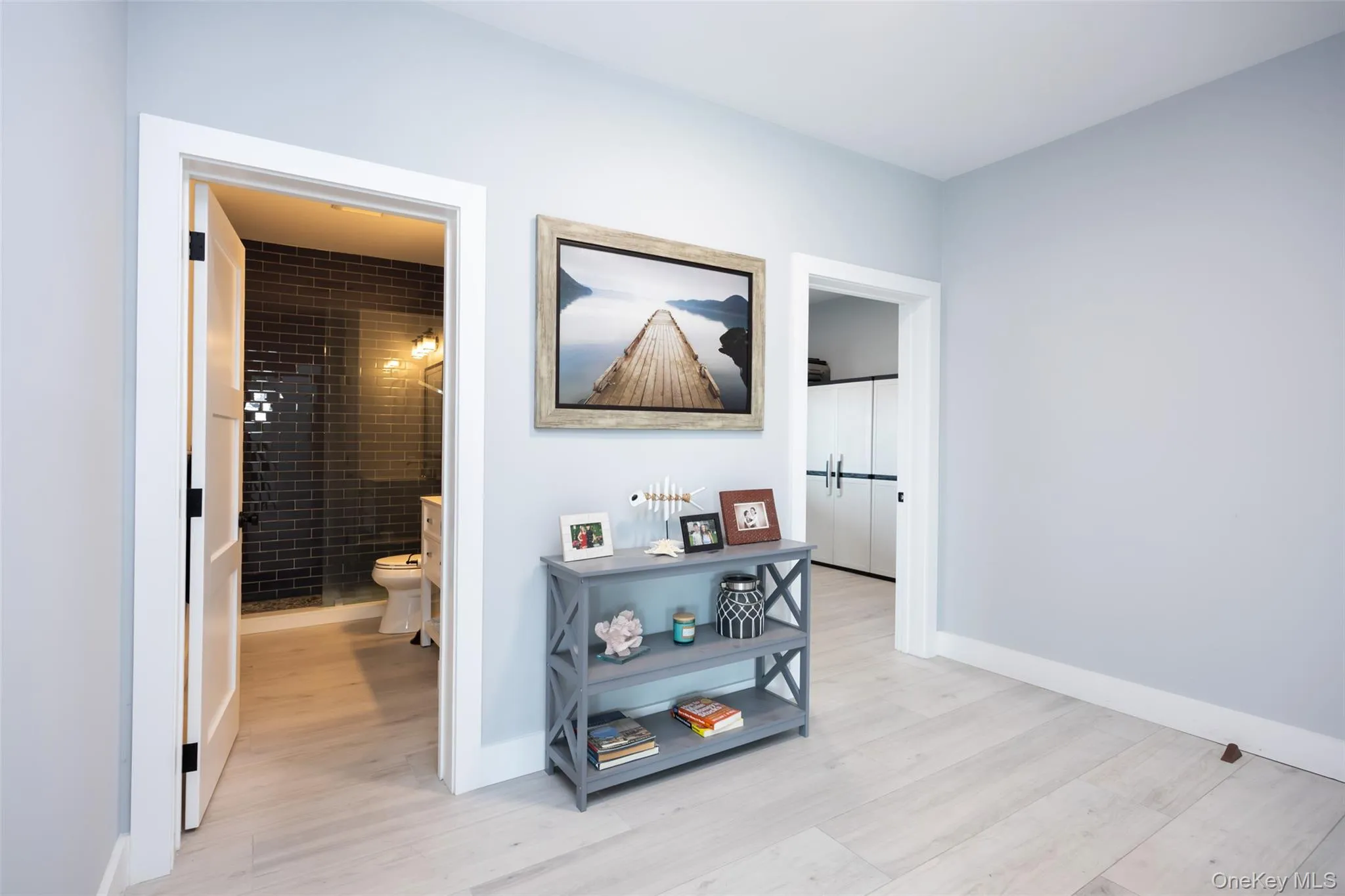 Corridor with light wood finished floors and baseboards Corridor with light wood finished floors and baseboards