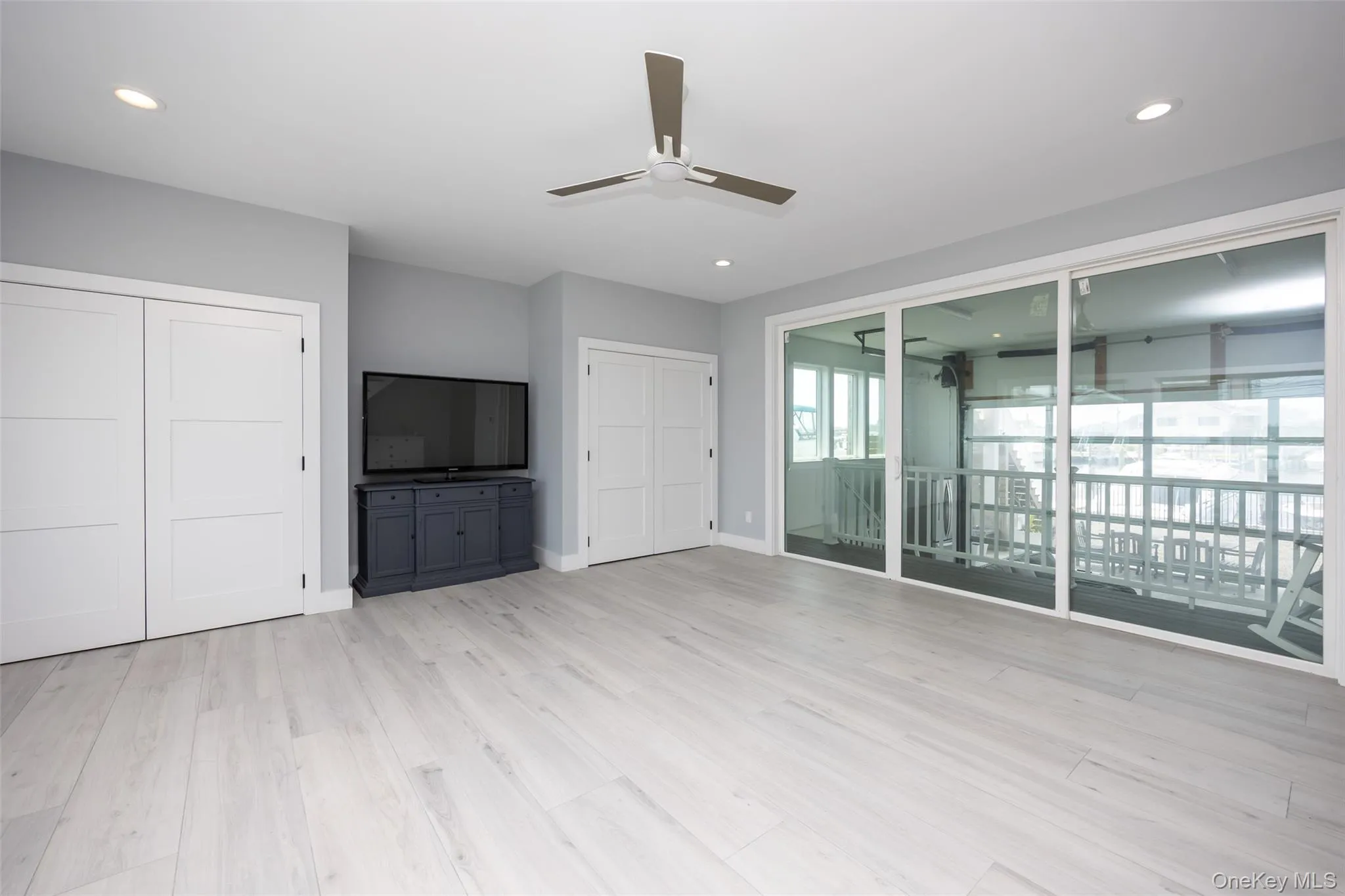Unfurnished living room with a ceiling fan, light wood-style floors, and recessed lighting Unfurnished living room with a ceiling fan, light wood-style floors, and recessed lighting