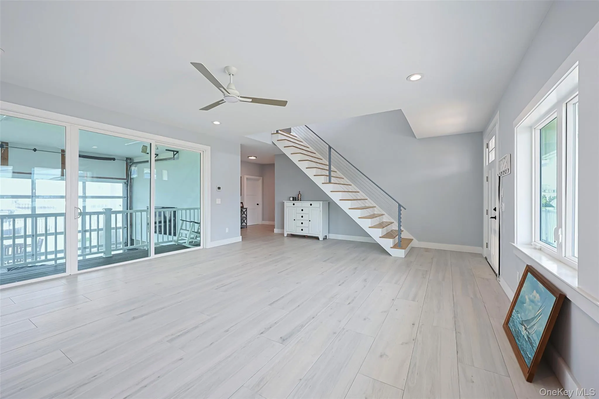 Entrance foyer featuring ceiling fan, light wood finished floors, stairs, and recessed lighting Entrance foyer featuring ceiling fan, light wood finished floors, stairs, and recessed lighting