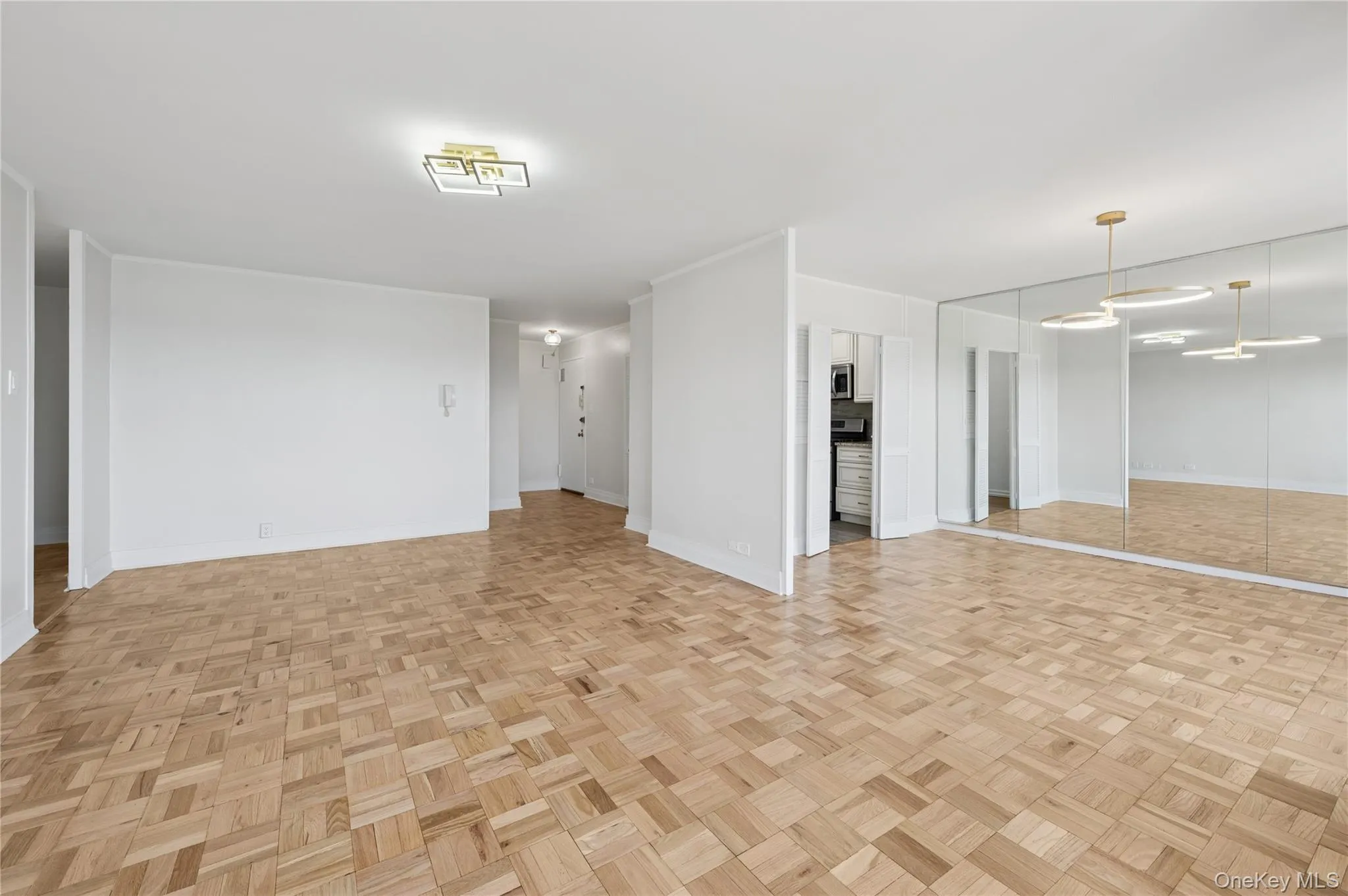 Unfurnished living room featuring baseboards Unfurnished living room featuring baseboards