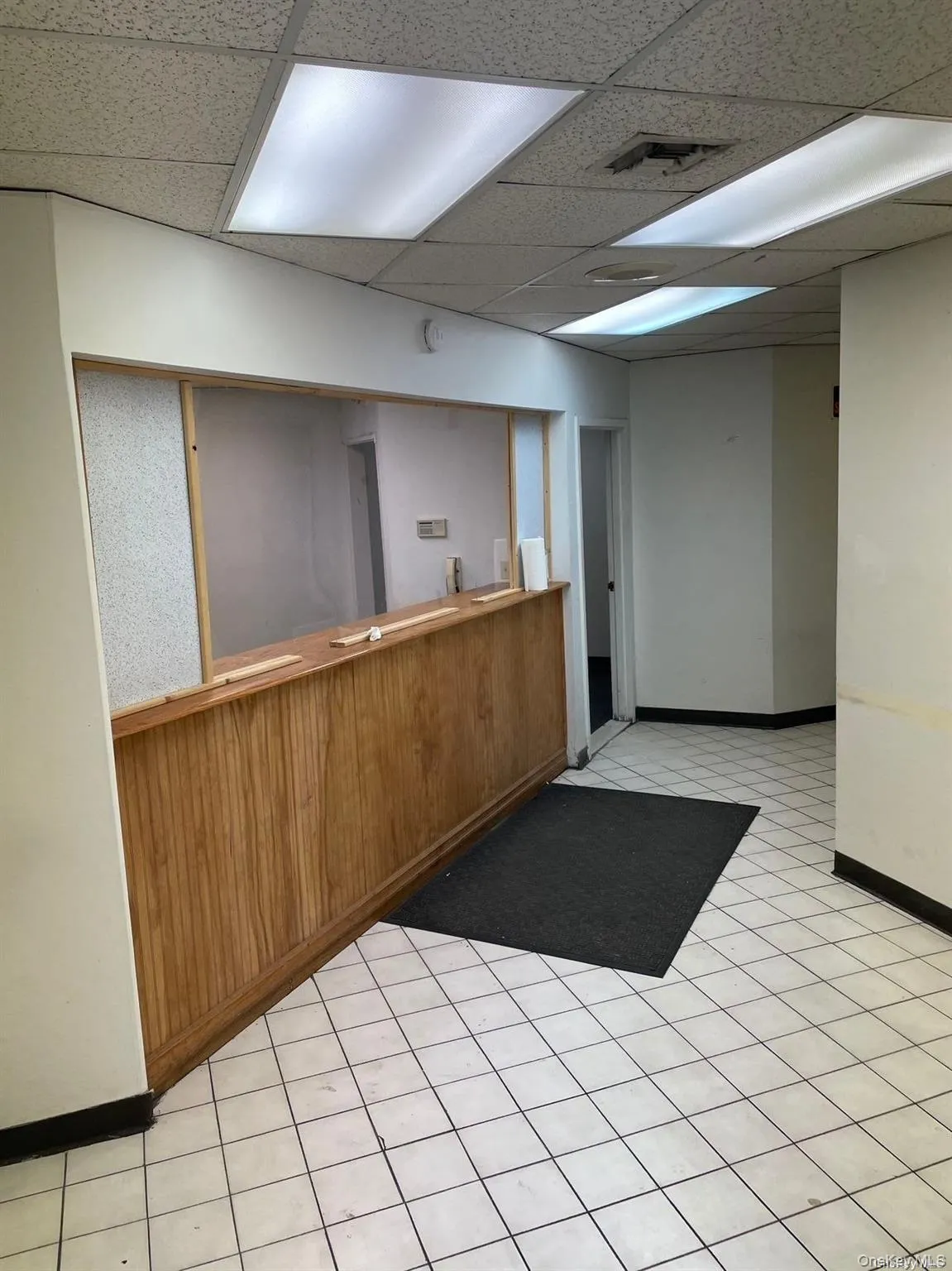 Reception featuring a drop ceiling Reception featuring a drop ceiling