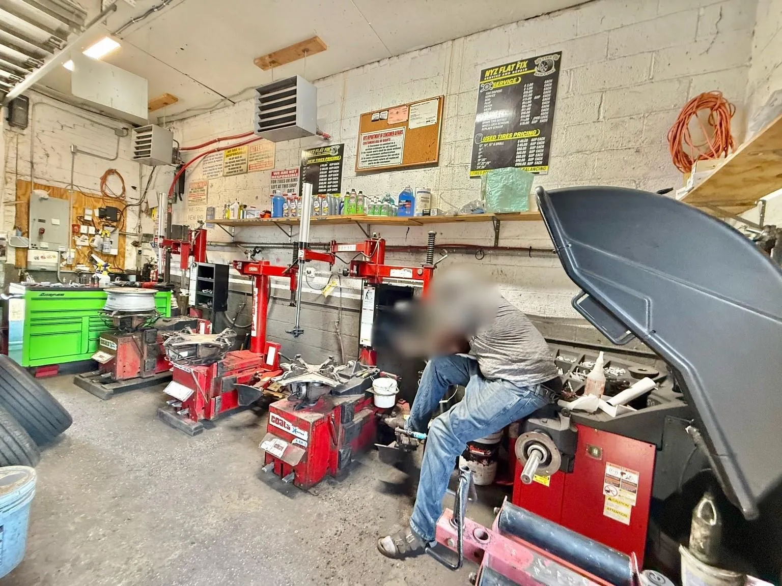 Garage featuring a workshop area Garage featuring a workshop area