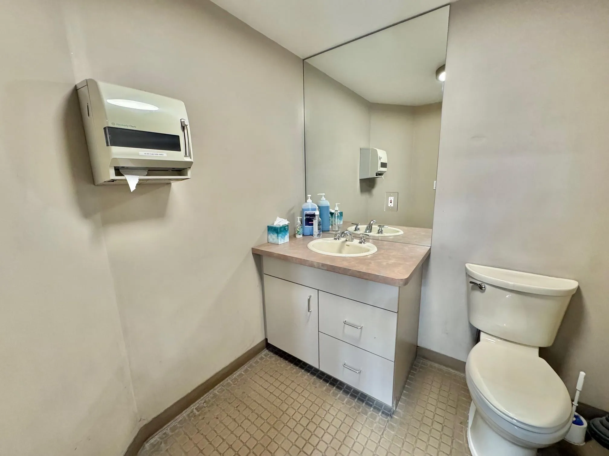 Half bathroom with toilet and vanity Half bathroom with toilet and vanity