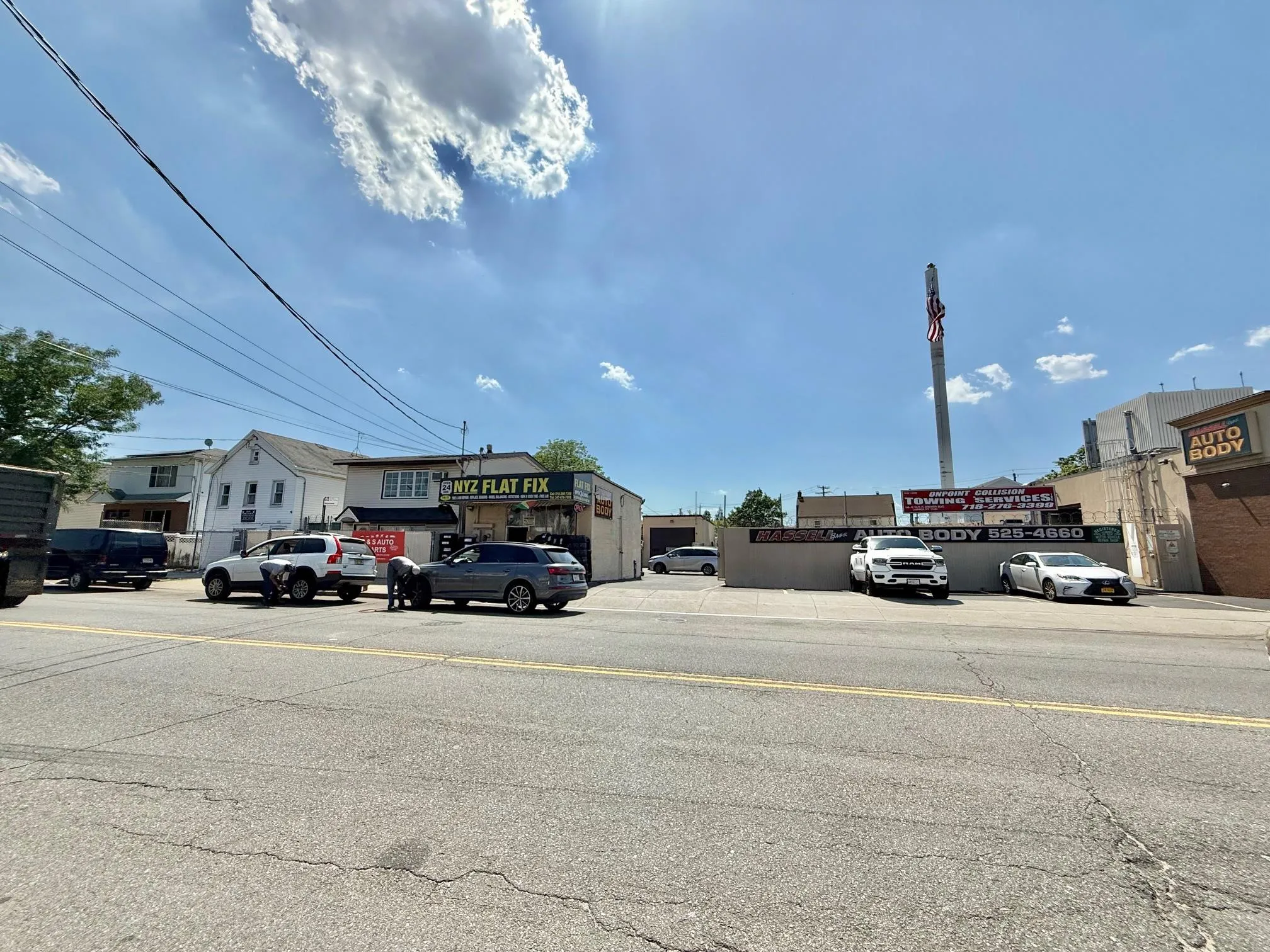 View of asphalt road featuring sidewalks View of asphalt road featuring sidewalks