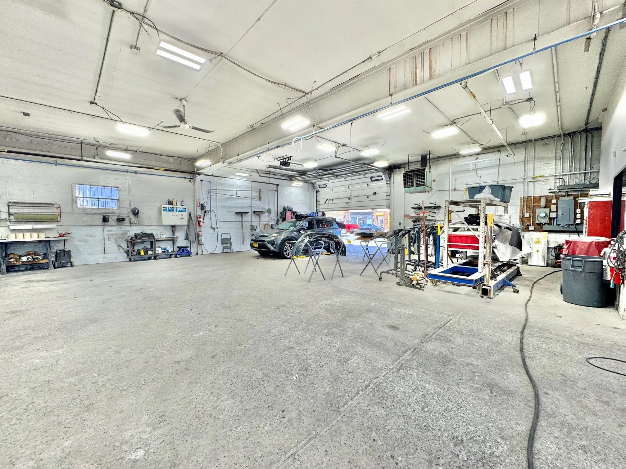 Garage featuring a workshop area Garage featuring a workshop area