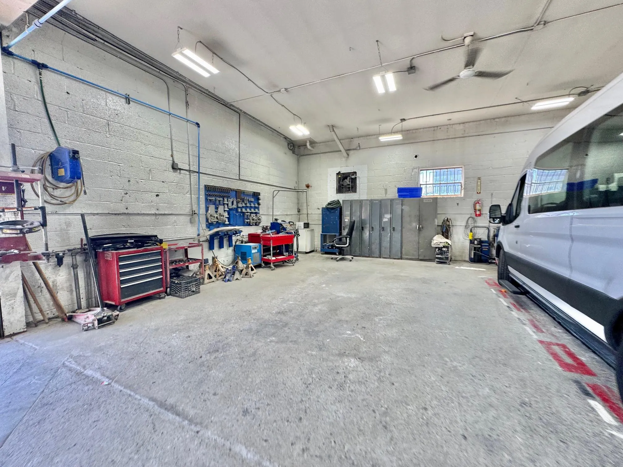 Garage featuring a ceiling fan Garage featuring a ceiling fan