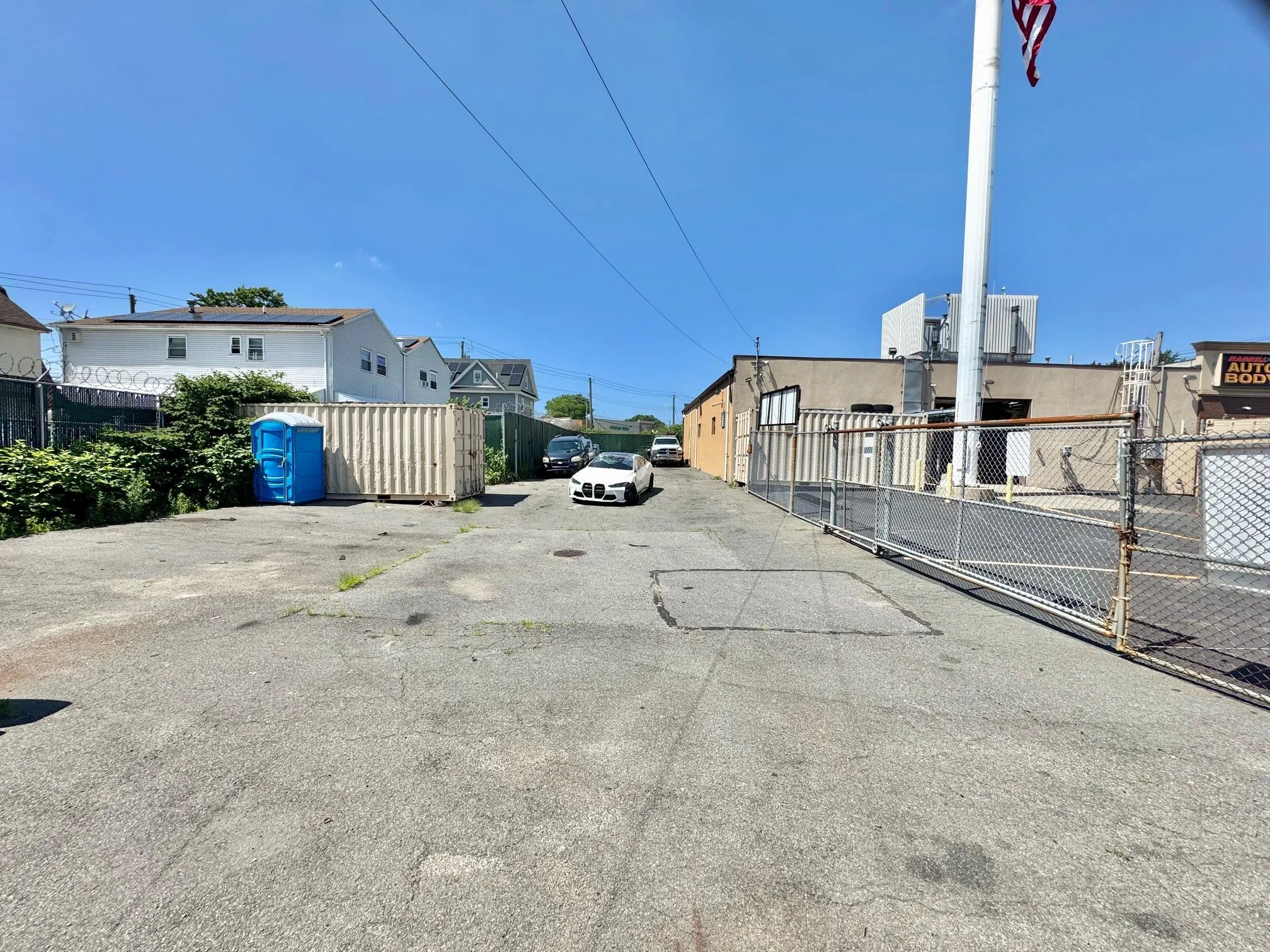 View of asphalt road with a gate View of asphalt road with a gate