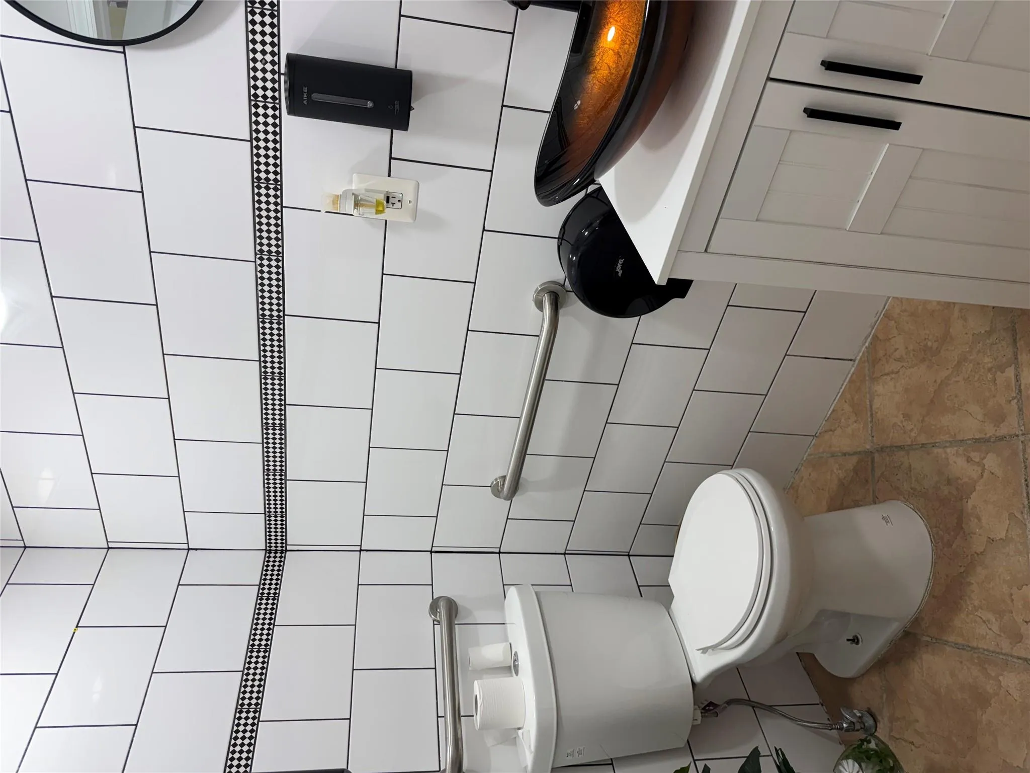 Bathroom featuring tile walls and vanity Bathroom featuring tile walls and vanity