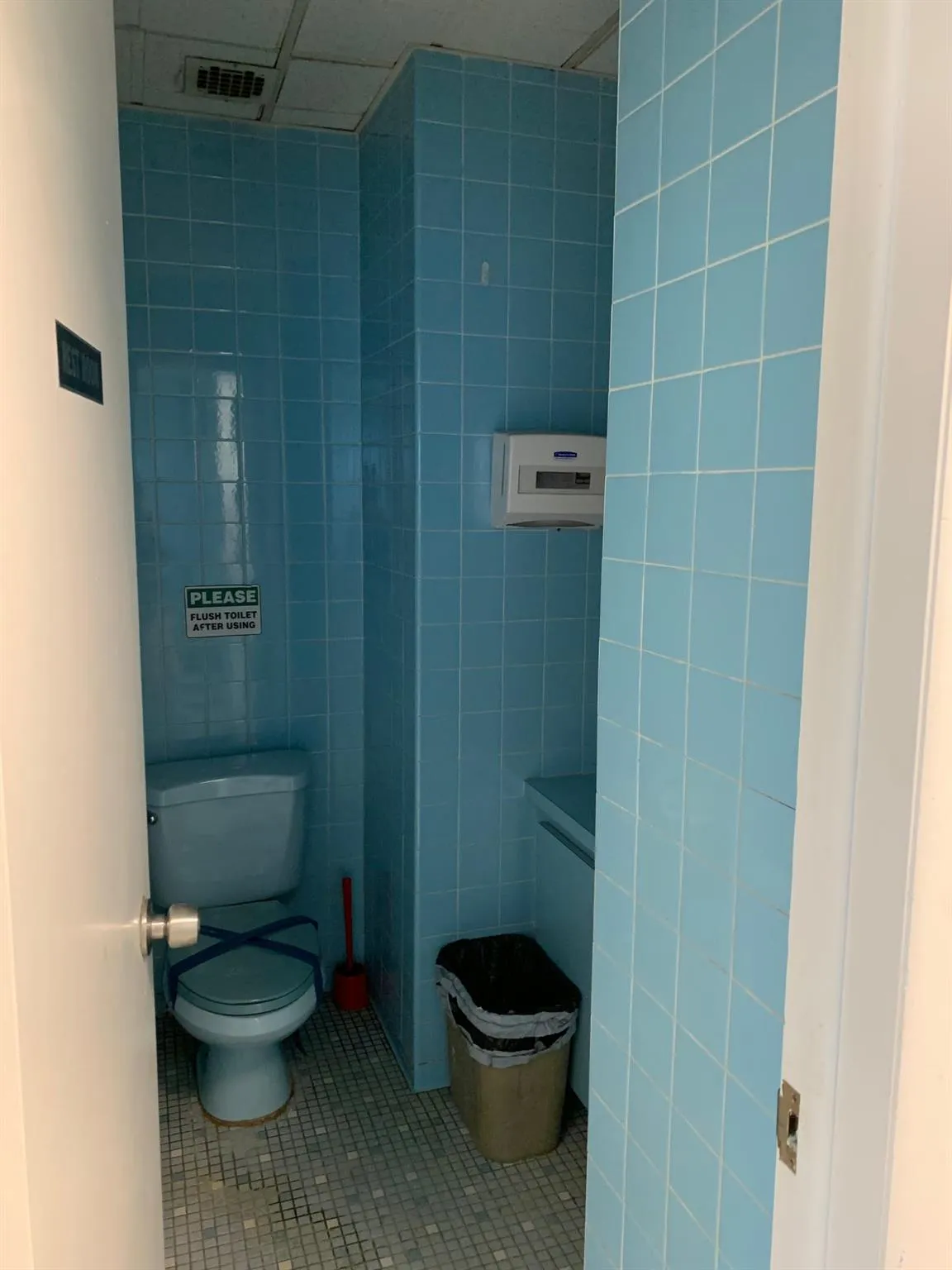 Bathroom featuring tile walls, tile patterned flooring, and tiled shower Bathroom featuring tile walls, tile patterned flooring, and tiled shower