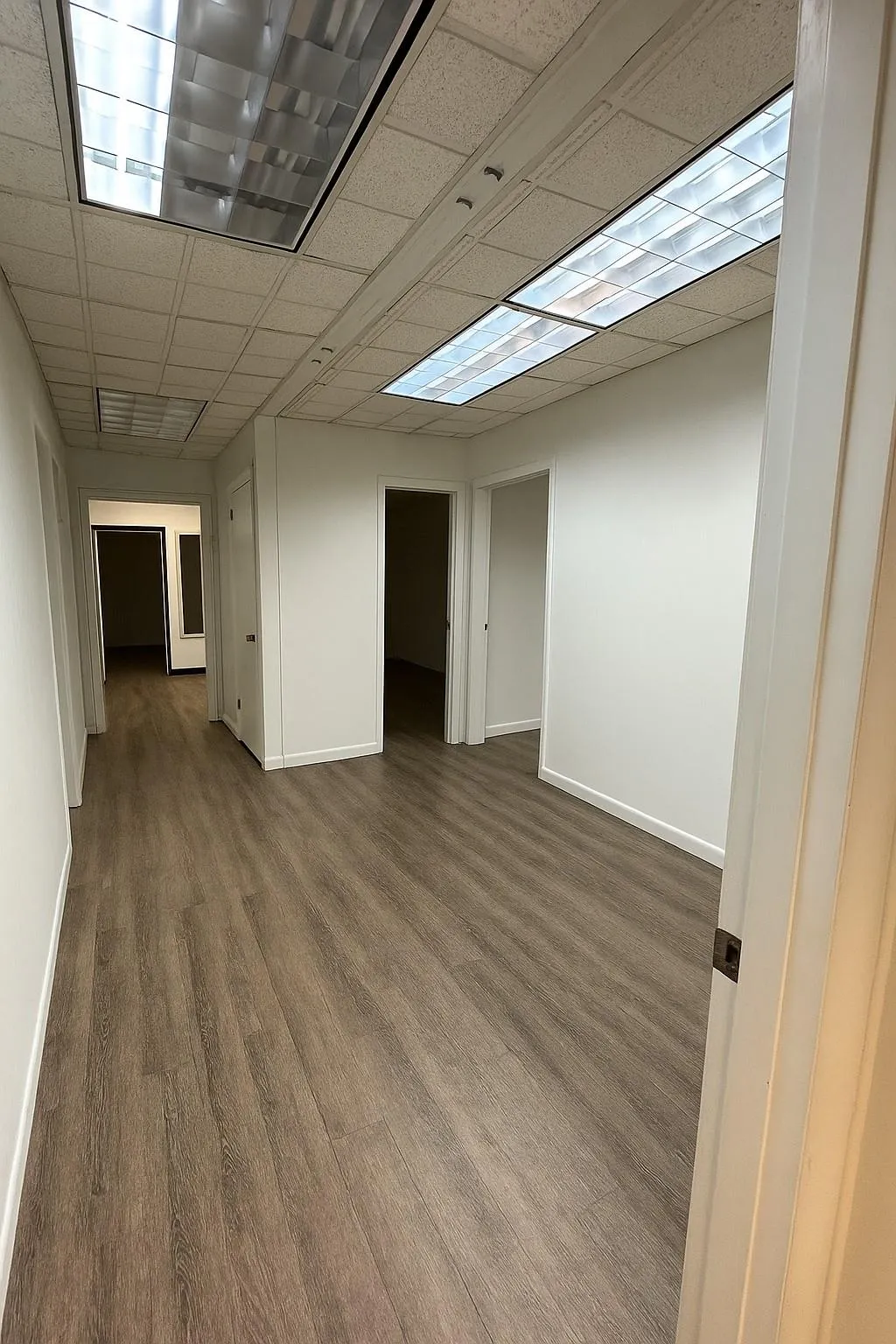 Below grade area with wood finished floors Below grade area with wood finished floors