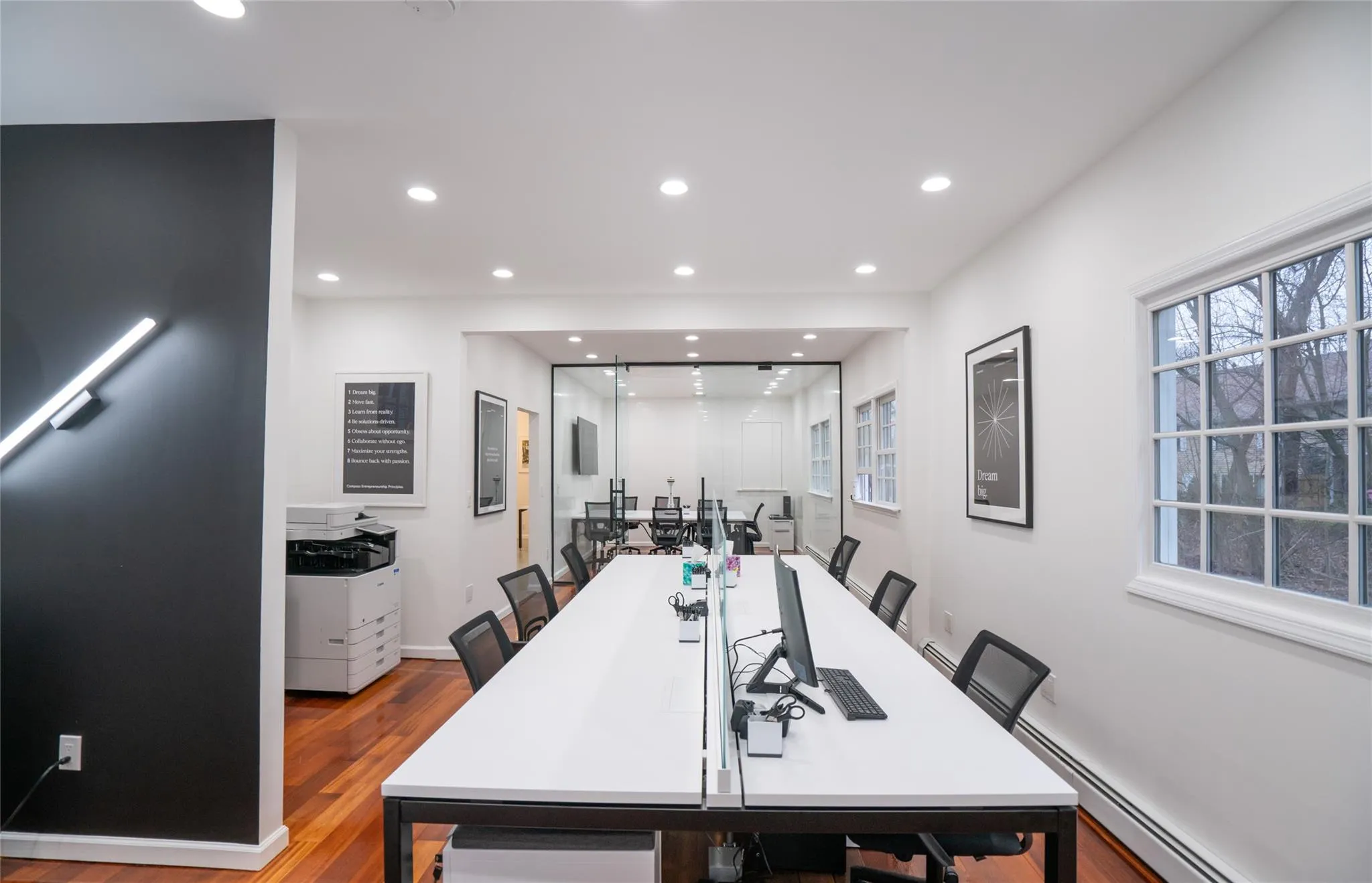 Dining area featuring wood finished floors, a baseboard heating unit, recessed lighting, and healthy amount of natural light Dining area featuring wood finished floors, a baseboard heating unit, recessed lighting, and healthy amount of natural light