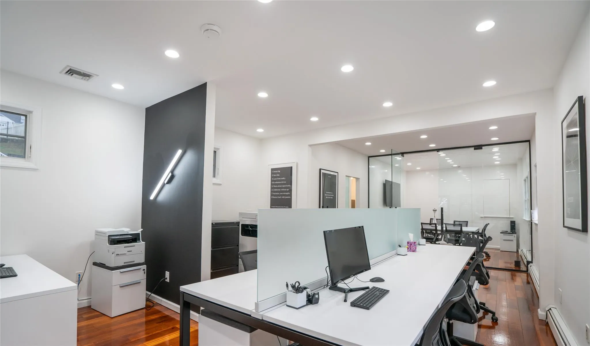 Office area featuring a baseboard heating unit, dark wood finished floors, and recessed lighting Office area featuring a baseboard heating unit, dark wood finished floors, and recessed lighting