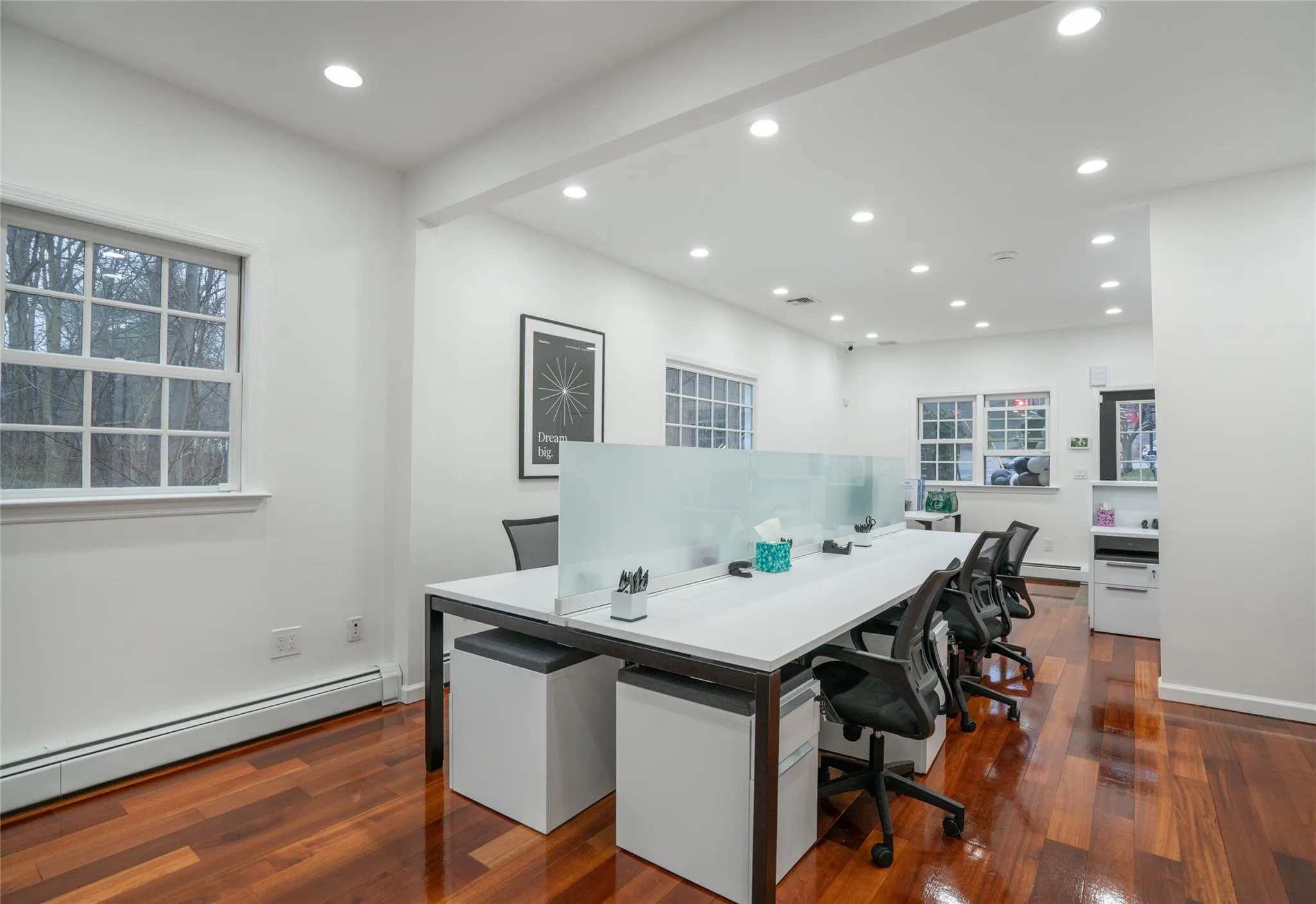 Home office with a baseboard heating unit, dark wood-style floors, and recessed lighting Home office with a baseboard heating unit, dark wood-style floors, and recessed lighting