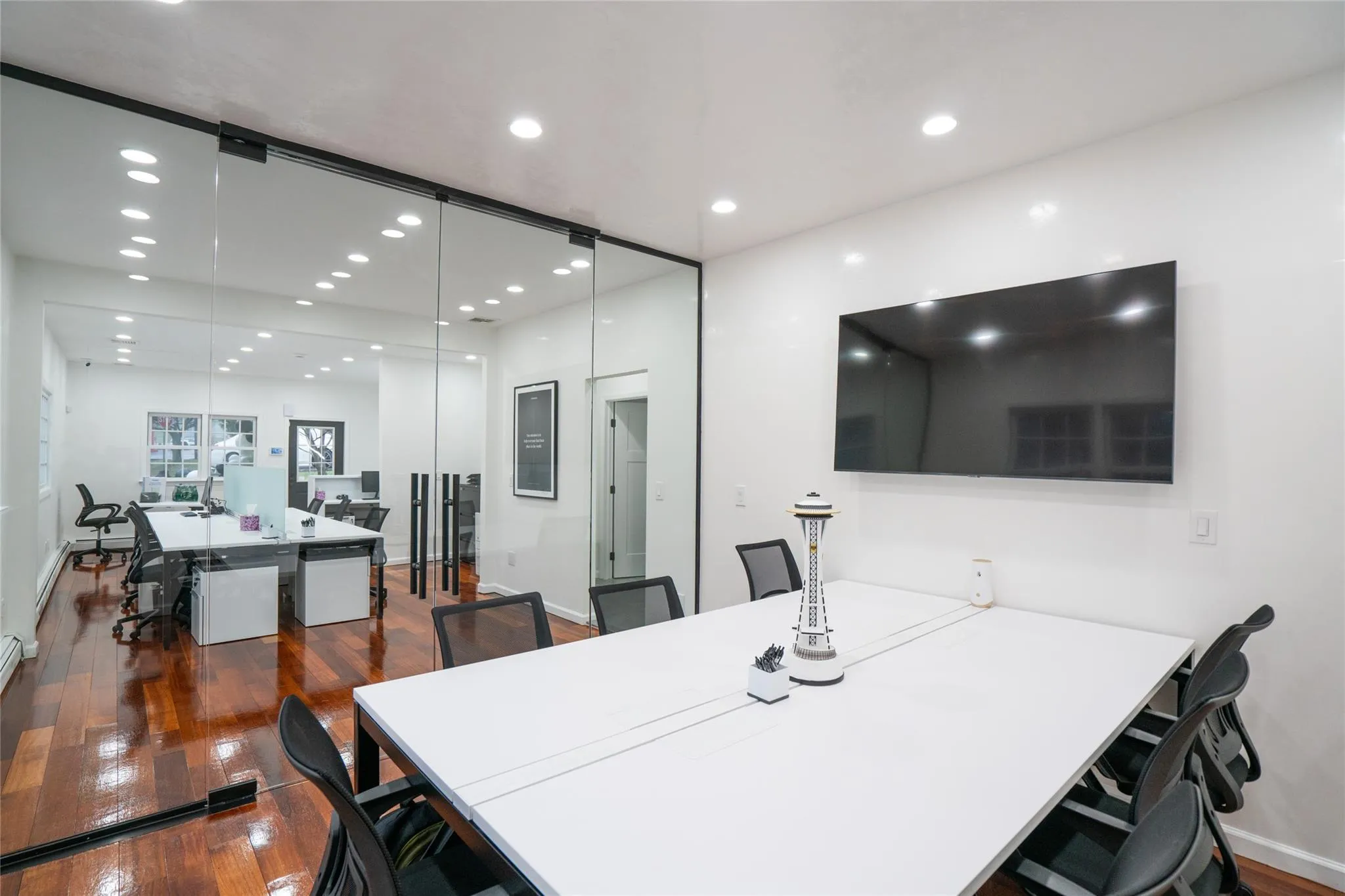 Office space with recessed lighting and hardwood / wood-style flooring Office space with recessed lighting and hardwood / wood-style flooring