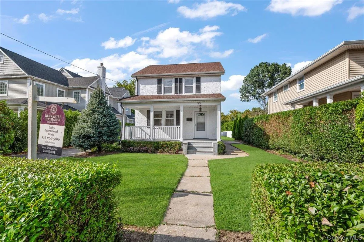 View of front of home featuring a porch and a front lawn View of front of home featuring a porch and a front lawn