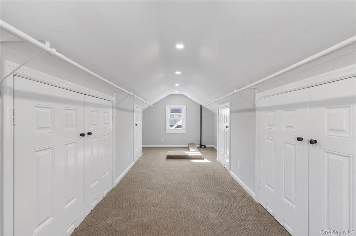 Additional living space with carpet floors, vaulted ceiling, and recessed lighting Additional living space with carpet floors, vaulted ceiling, and recessed lighting