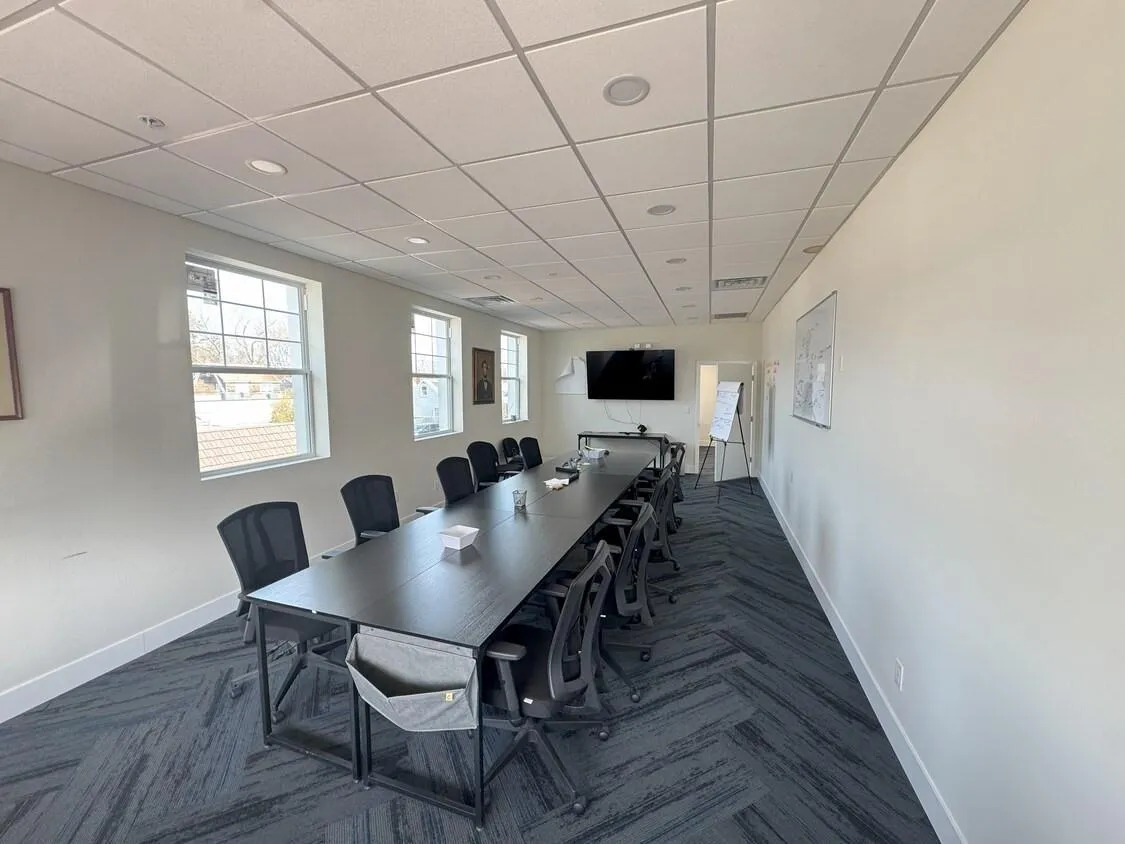 Conference room with recessed lighting and a drop ceiling Conference room with recessed lighting and a drop ceiling