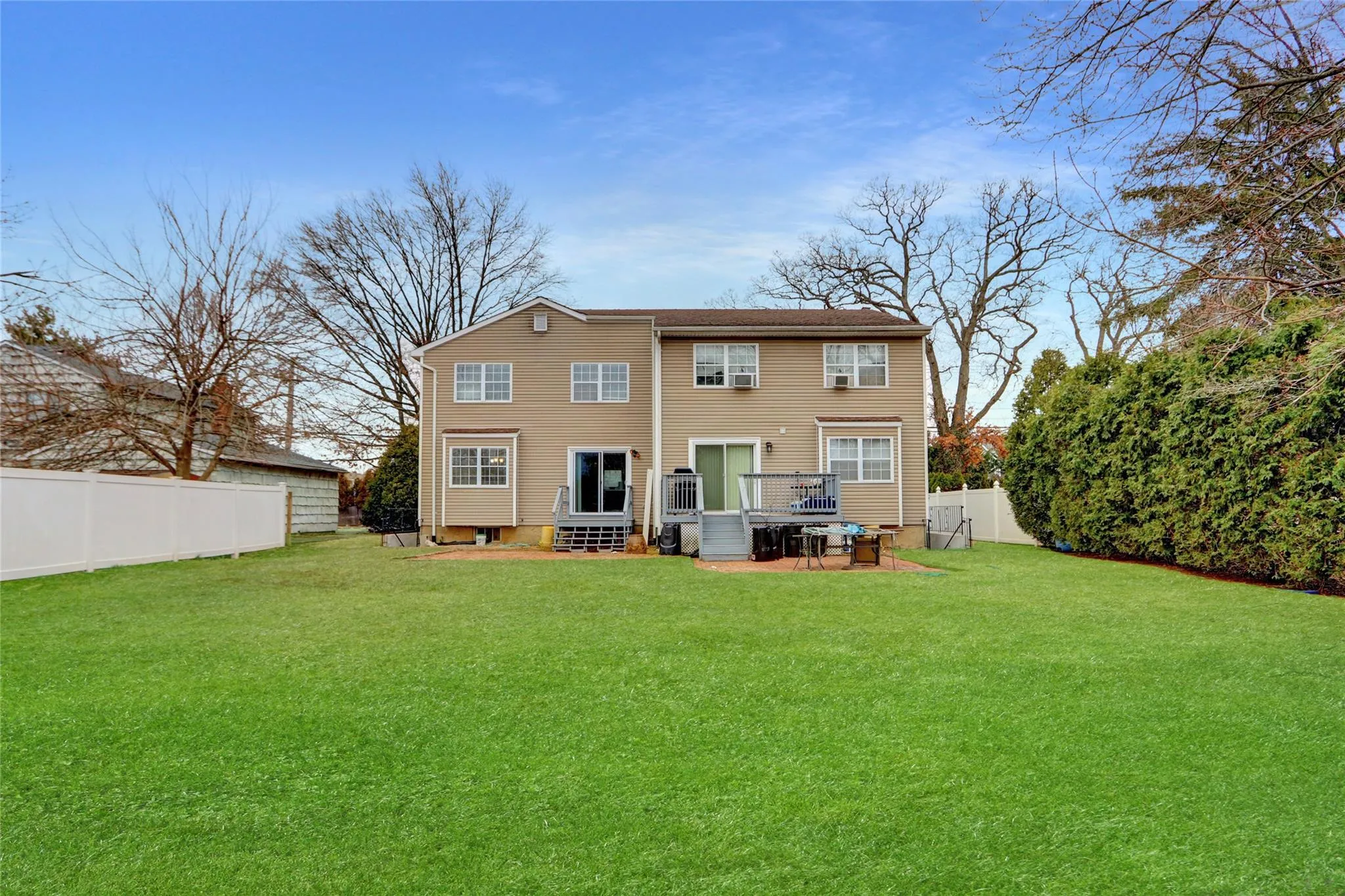 Rear view of house with a fenced backyard Rear view of house with a fenced backyard