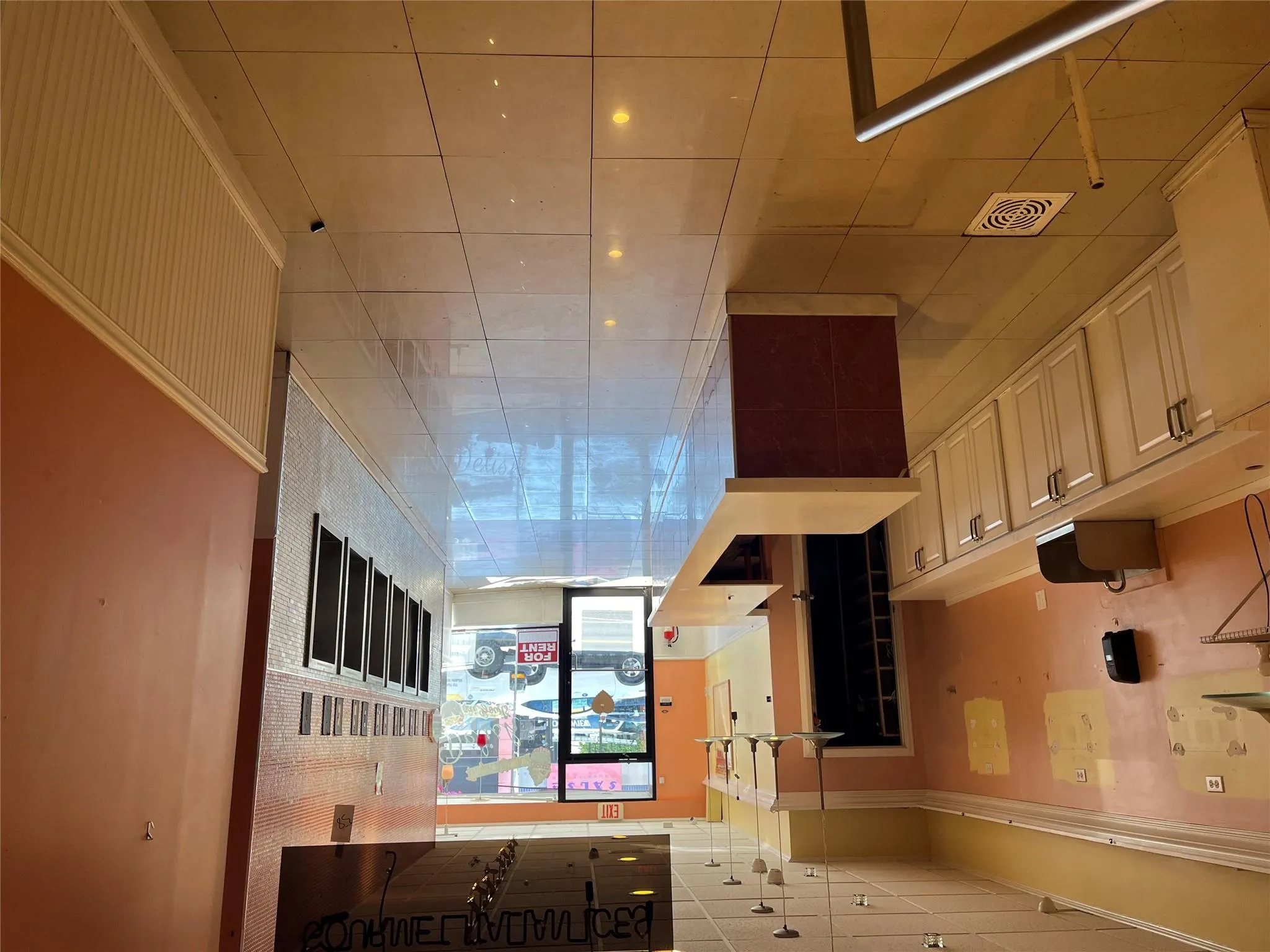 Hallway with wainscoting and light tile patterned floors Hallway with wainscoting and light tile patterned floors