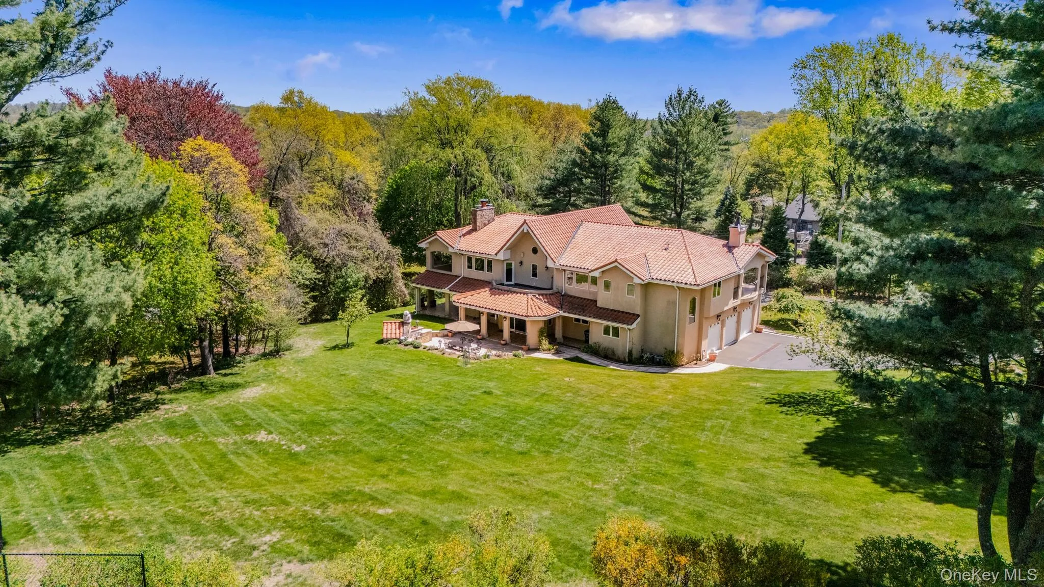 View from above of property featuring a heavily wooded area View from above of property featuring a heavily wooded area