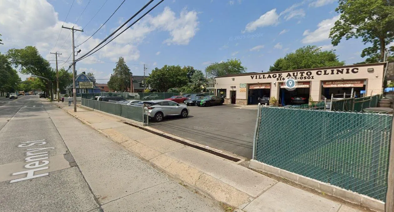 View of asphalt street with sidewalks View of asphalt street with sidewalks