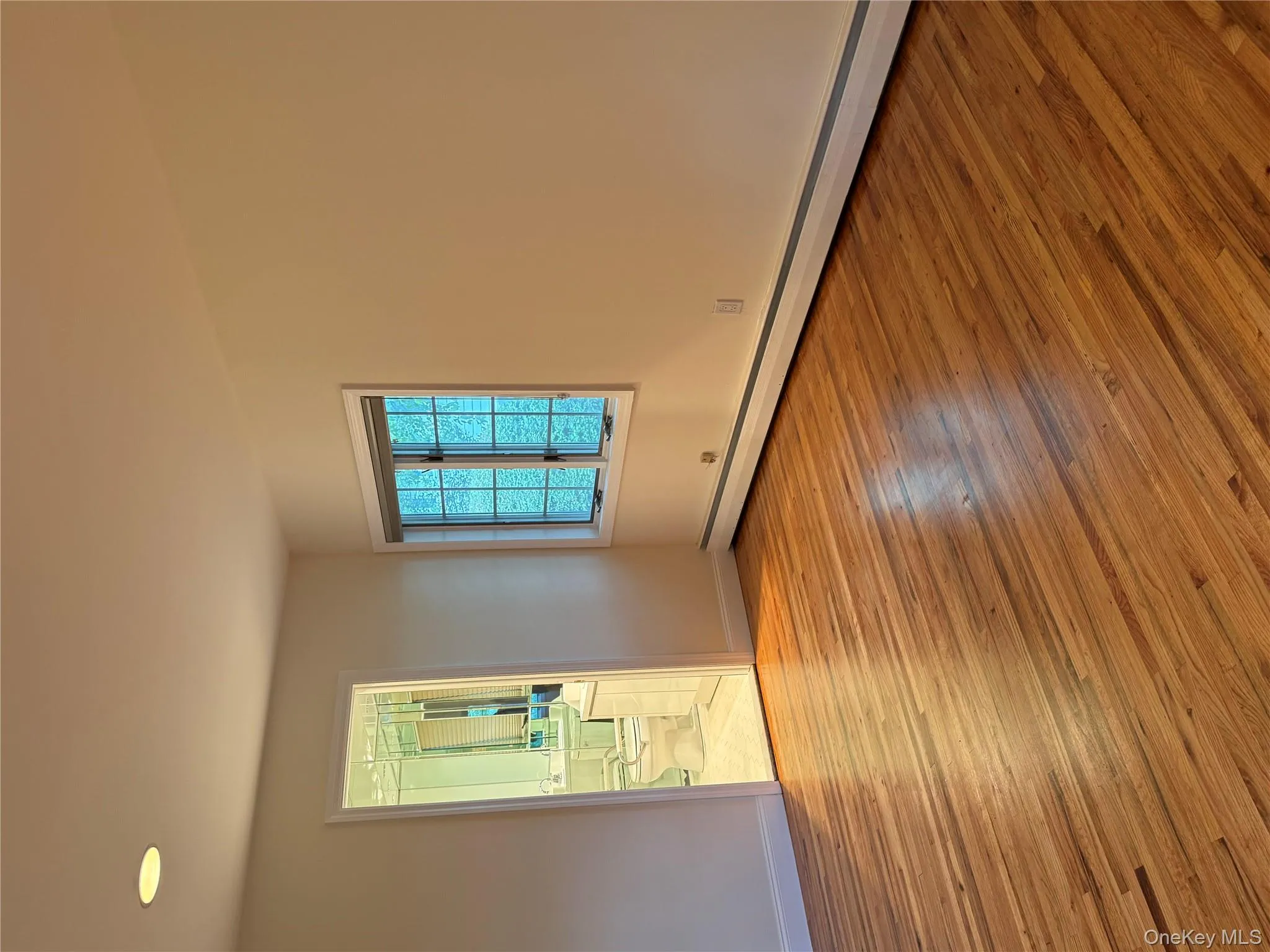 MBR with Mbath, Empty room with light wood finished floors and a baseboard heating unit MBR with Mbath, Empty room with light wood finished floors and a baseboard heating unit