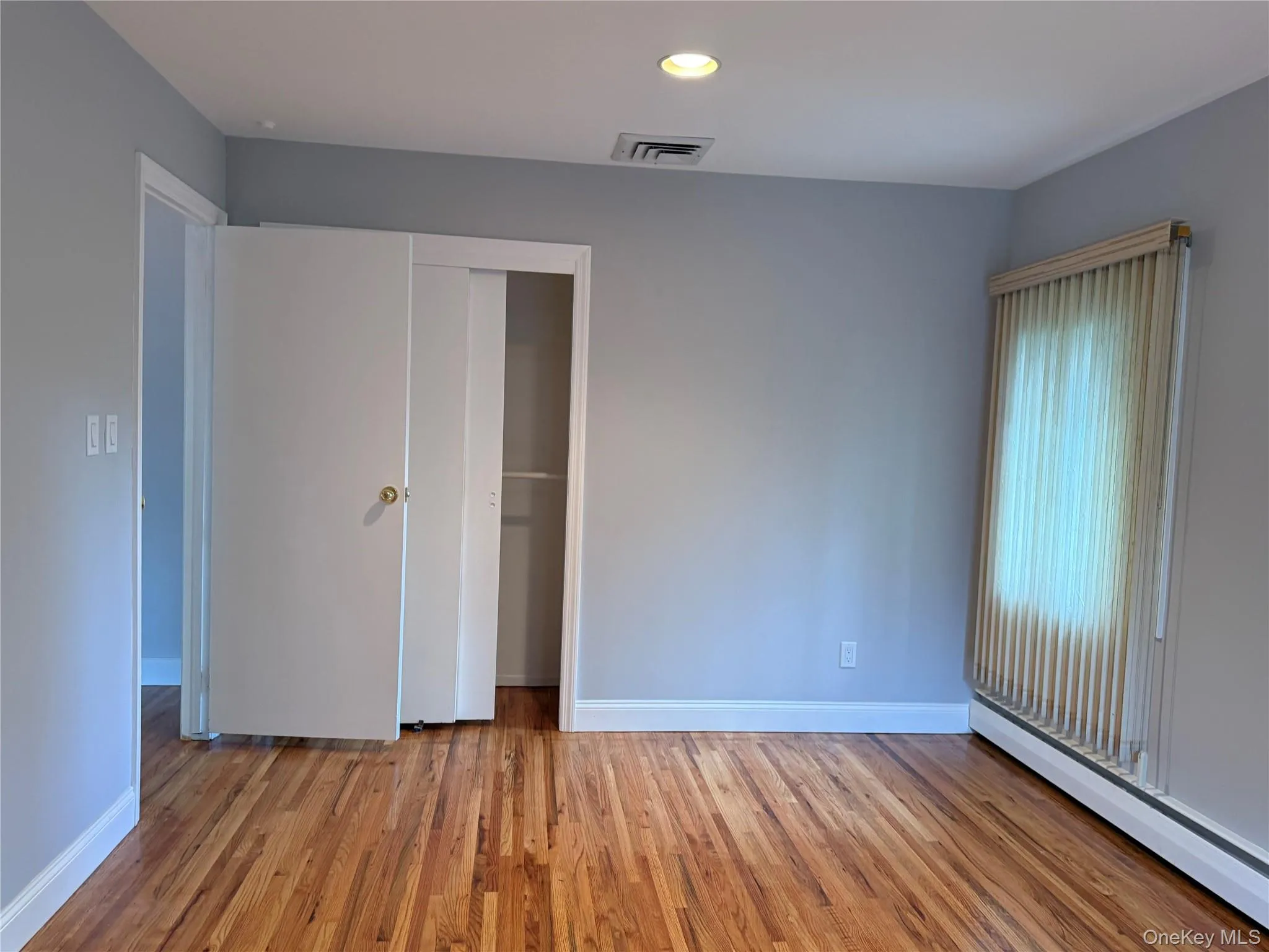 Bedrm # 3 Unfurnished bedroom featuring a baseboard heating unit, light wood-type flooring, a closet, and recessed lighting Bedrm # 3 Unfurnished bedroom featuring a baseboard heating unit, light wood-type flooring, a closet, and recessed lighting