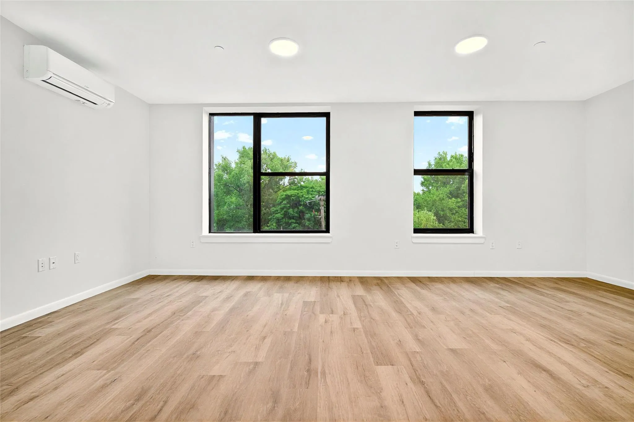 Front living area with view to the front windows with view of the park Front living area with view to the front windows with view of the park