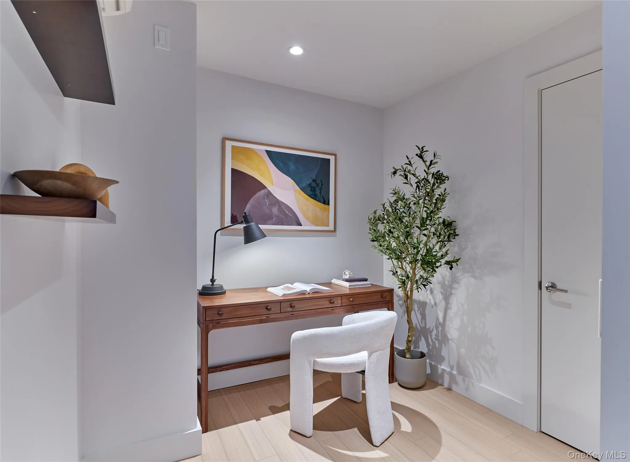 Home office featuring light wood-style floors and recessed lighting Home office featuring light wood-style floors and recessed lighting