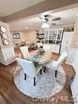 Dining room featuring wood finished floors and ceiling fan Dining room featuring wood finished floors and ceiling fan