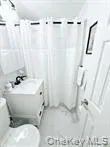 Full bath featuring a shower with shower curtain and vanity Full bath featuring a shower with shower curtain and vanity