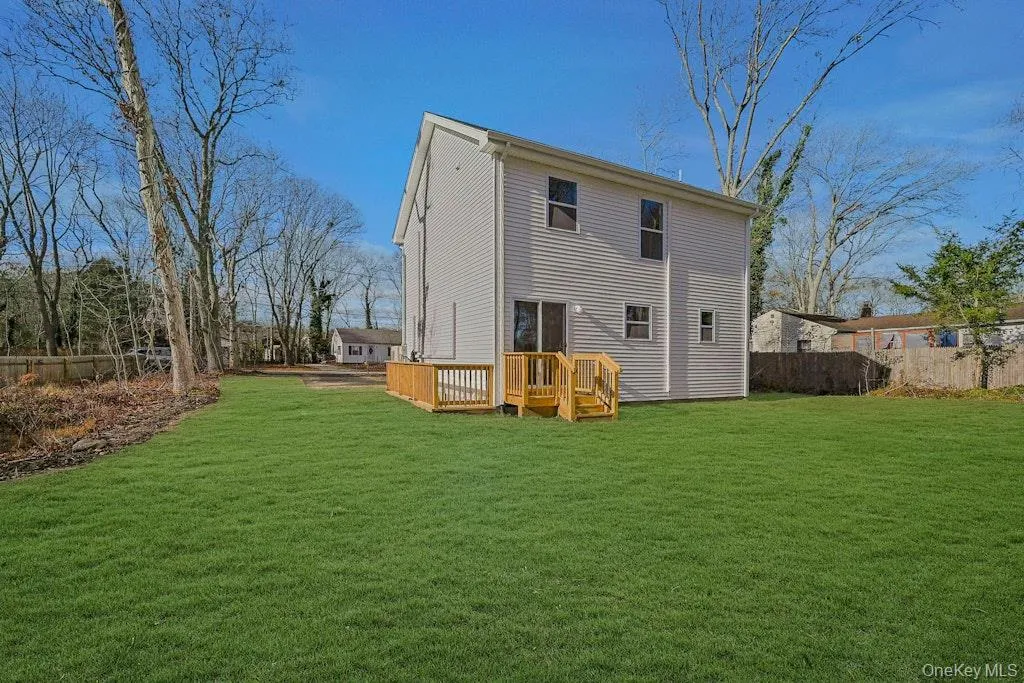 Back of house featuring a wooden deck Back of house featuring a wooden deck