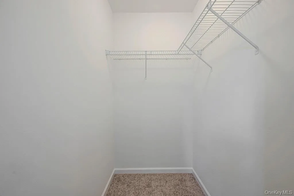Walk in closet in primary bedroom Walk in closet in primary bedroom