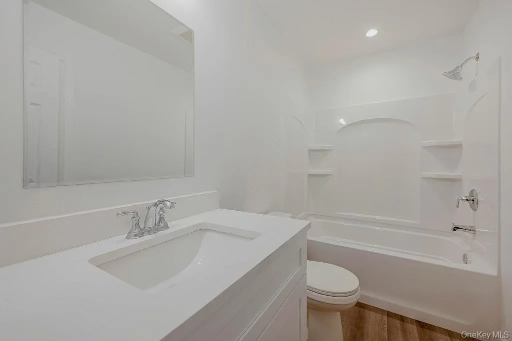 Full bathroom with vanity, shower / tub Full bathroom with vanity, shower / tub
