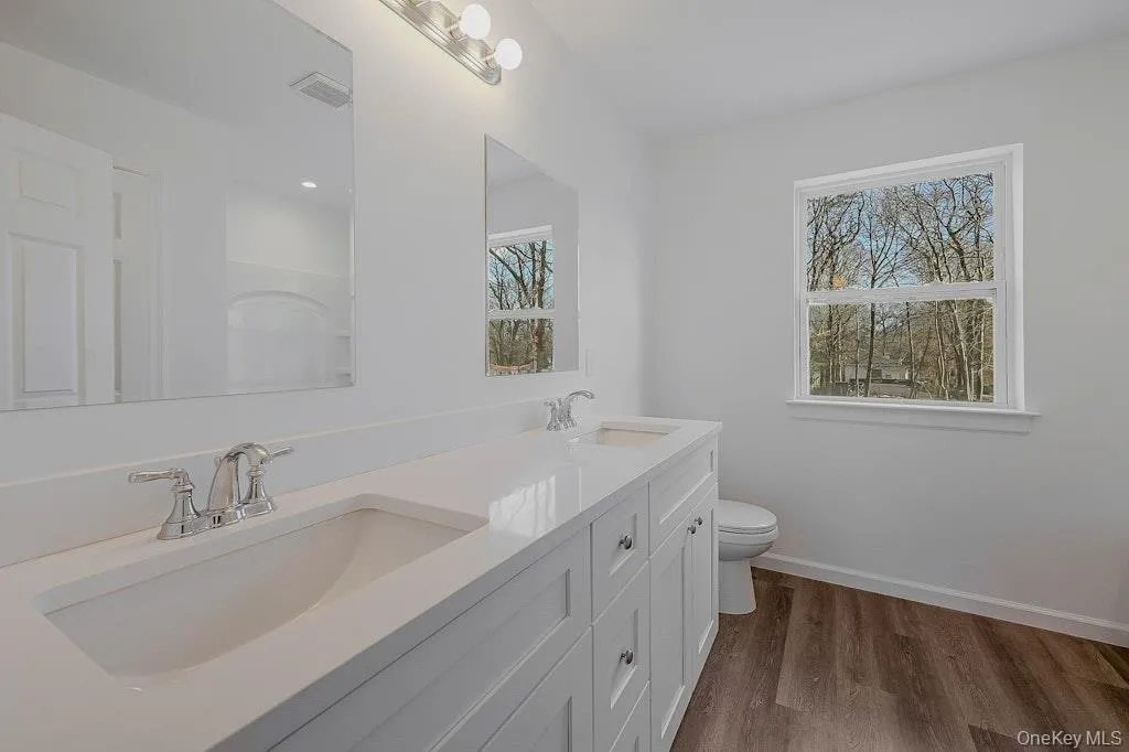 Bathroom featuring double vanity Bathroom featuring double vanity