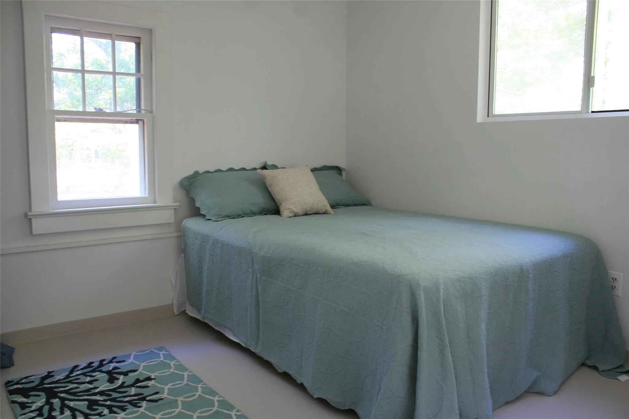Bedroom featuring multiple windows Bedroom featuring multiple windows