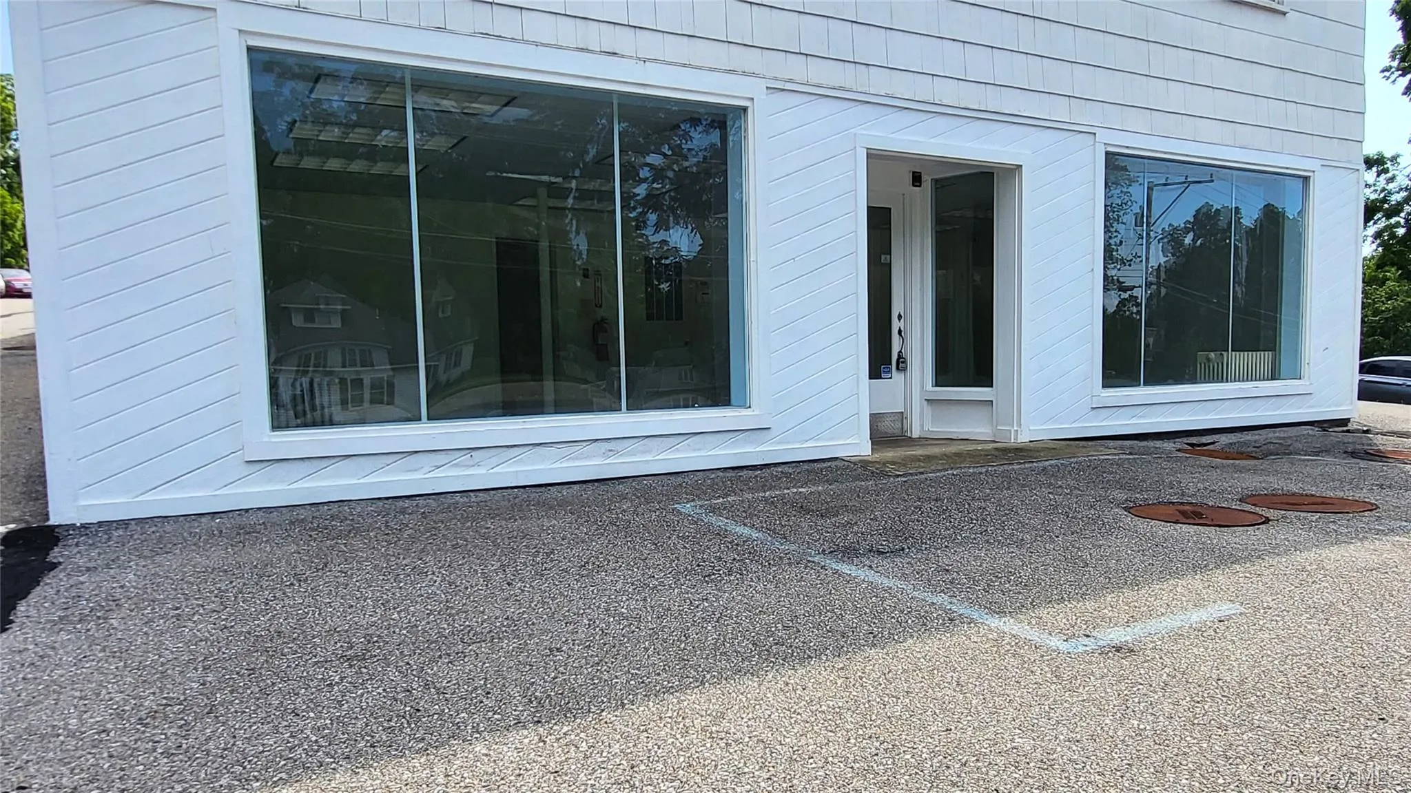 Doorway to property with uncovered parking Doorway to property with uncovered parking