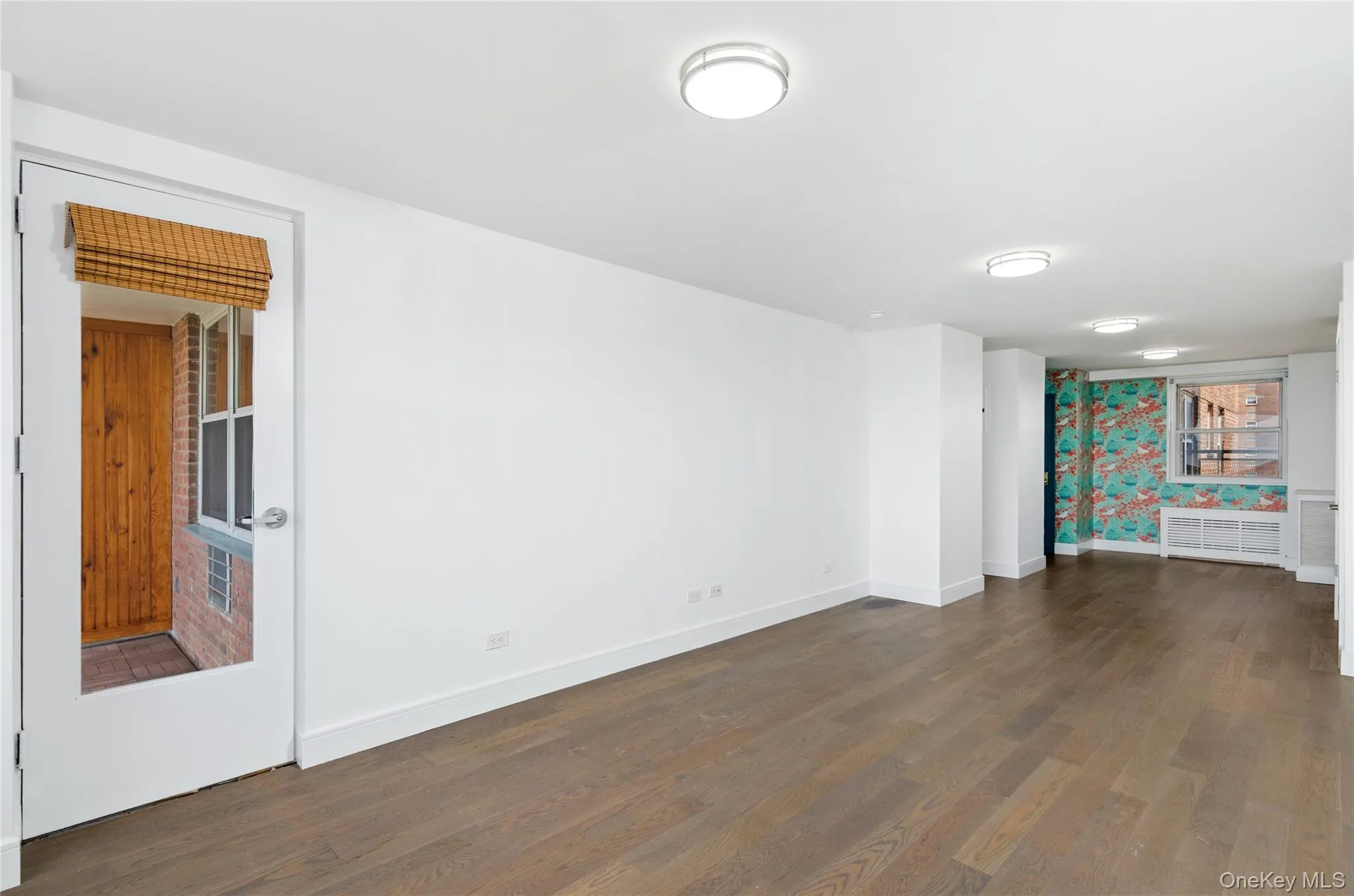 Spare room with wood finished floors Spare room with wood finished floors