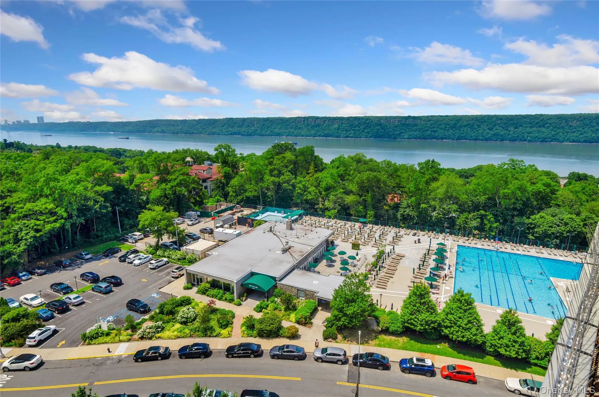 Drone / aerial view of a large body of water and a heavily wooded area Drone / aerial view of a large body of water and a heavily wooded area
