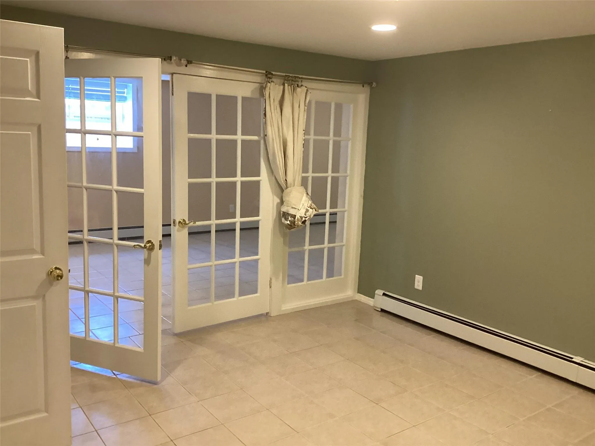 Spare room featuring a baseboard heating unit, tile patterned floors, recessed lighting, and a baseboard radiator Spare room featuring a baseboard heating unit, tile patterned floors, recessed lighting, and a baseboard radiator