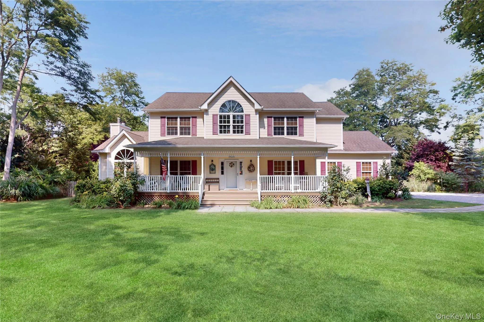 View of front of property with a front lawn and a porch View of front of property with a front lawn and a porch